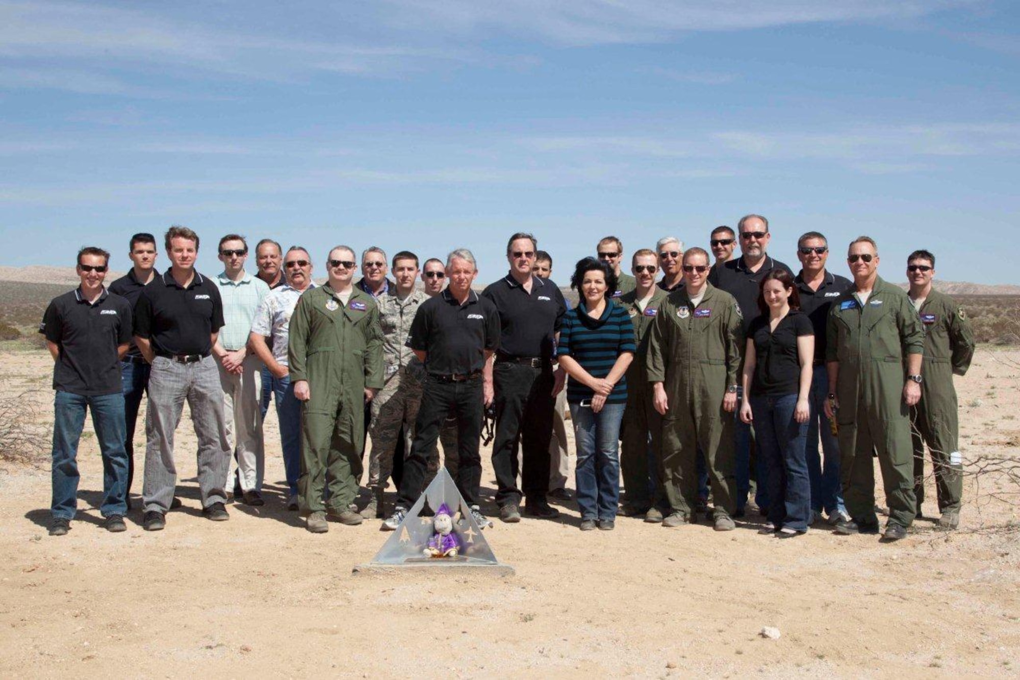 Members of the F-22 Combined Test Force gathered to place the memorial at the F-22 crash site March 25, which took the life of Lockheed Martin test pilot David P. Cooley in 2009. (Courtesy photo) 
