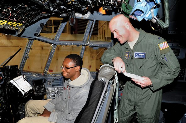 Former Aviation Explorer and current member of the 357th AS, 1st Lt. Joshua Odom gives a member of the local AE chapter a tour of the flight deck.