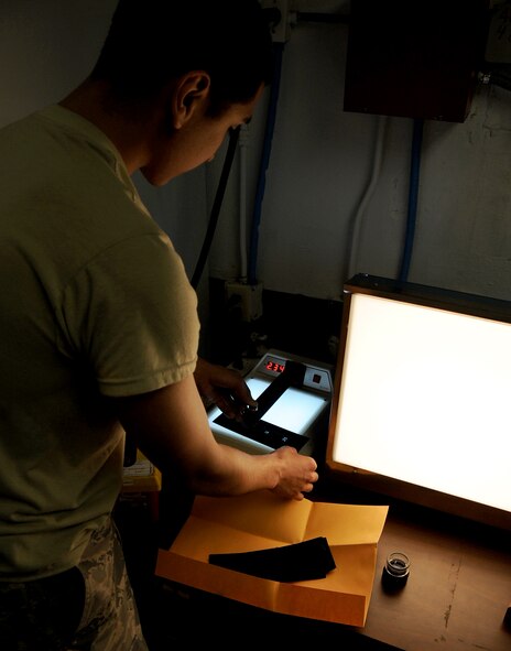 Senior Airman Leonard Avalos, 2nd Maintenance Squadron non-destructive inspection journeyman, checks the exposure on an X-ray film on Barksdale Air Force Base, La., March. 25, 2014. These X-ray films are used to check for cracks in welds by 2nd MXS metals technology Airmen completing their welding certification. (U.S. Air Force photo/Staff Sgt. Jason McCasland)
