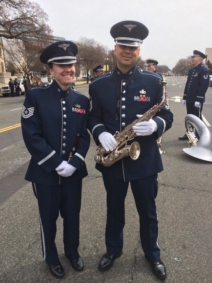 TSgt Megan Neal and MSgt Jeremy Koch join the Cermonial Brass along with other members of the USAF Band to march in the 2014 St. Patrick's Day parade in downtown Washington DC (US Air Force Photo/released).