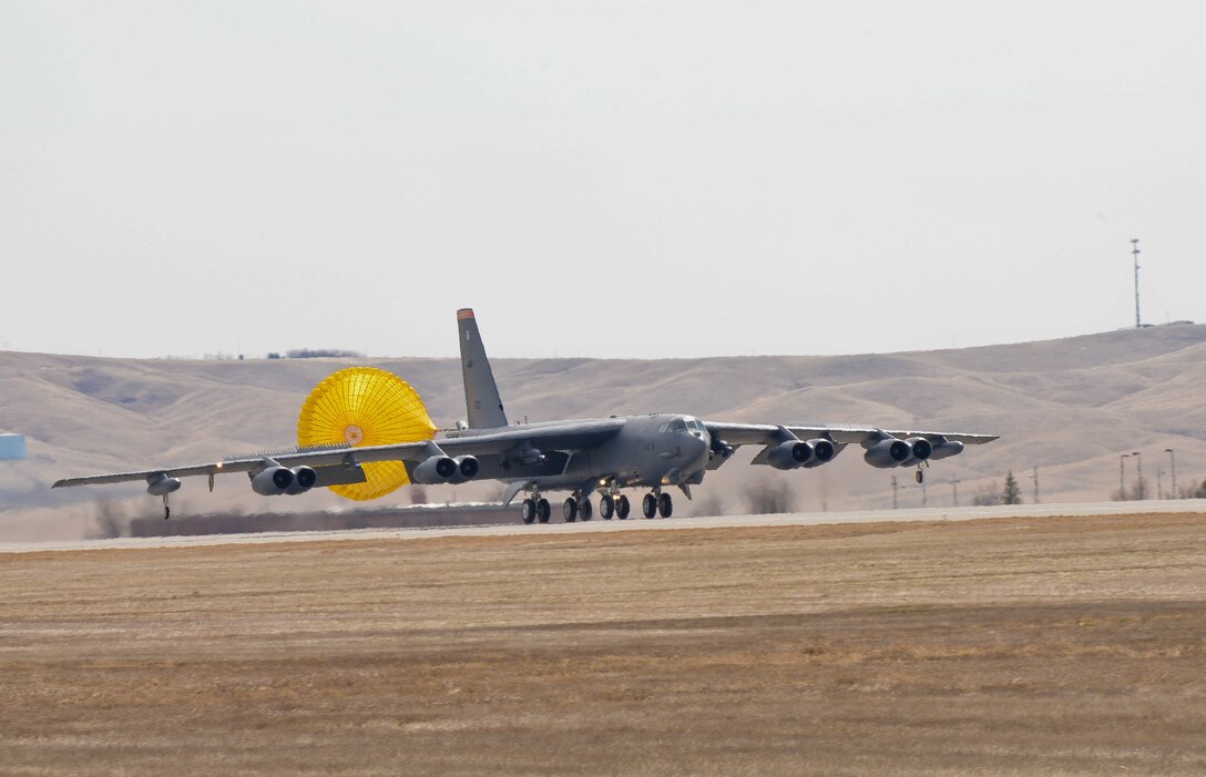 A B-52H Stratofortress from the 5th Bomb Wing at Minot Air Force Base, N.D., deploys a parachute after landing at Ellsworth AFB, S.D., March 26, 2014. More than 300 Airmen and eight bombers from Minot will be temporarily operating out of Ellsworth during a runway repair project at their base. (U.S. Air Force photo by Senior Airman Zachary Hada/Released)