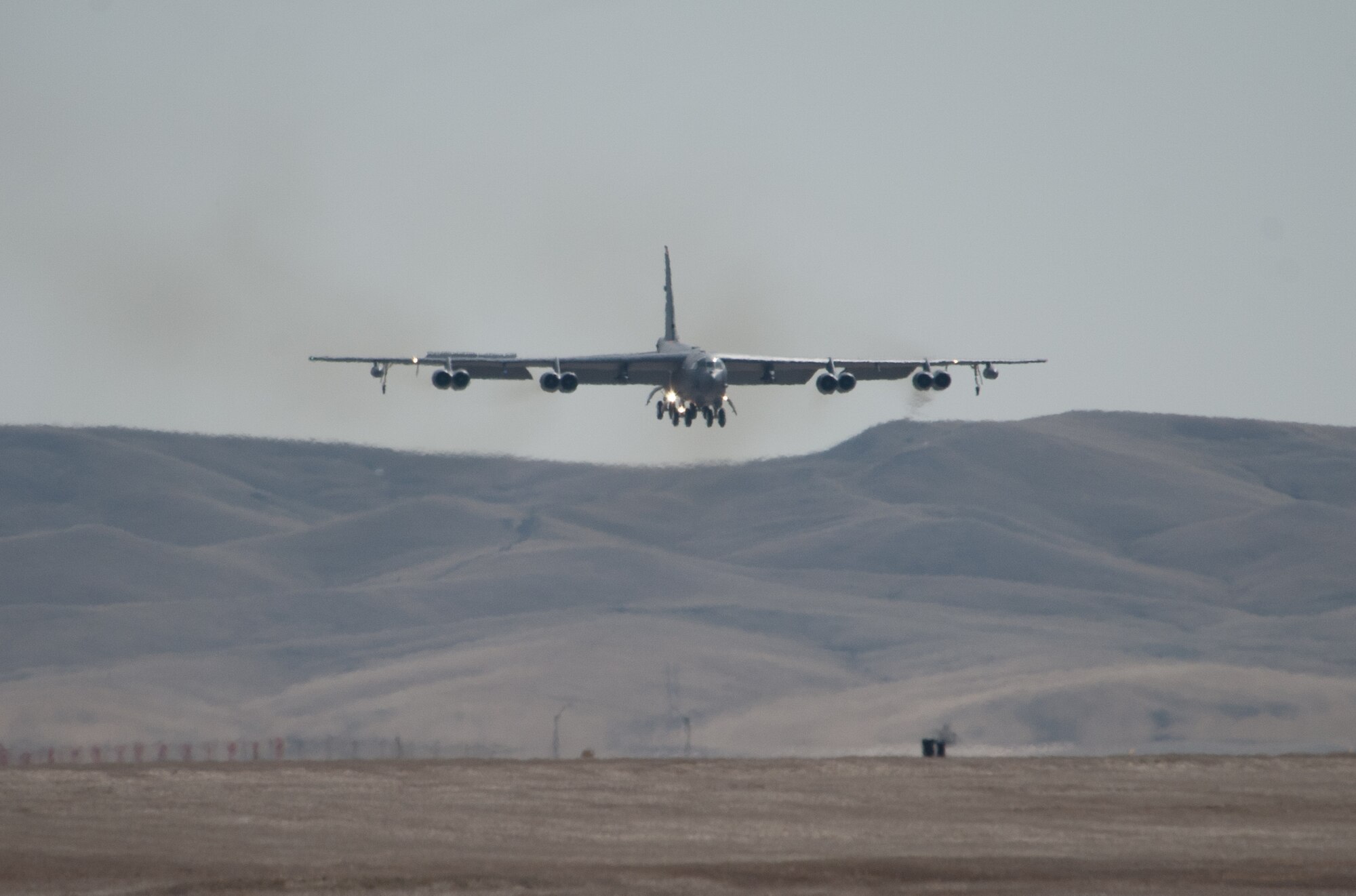 A B-52H Stratofortress from the 5th Bomb Wing at Minot Air Force Base, N.D. lands at Ellsworth AFB, S.D., March 26, 2014. Due to a runway reconstruction, approximately eight B-52 aircraft and 300 Airmen from Minot will be temporarily operating out of Ellsworth for six months to ensure the B-52 maintains its mission capability until the runway project is complete. (U.S. Air Force photo by Senior Airman Alystria Maurer/Released)