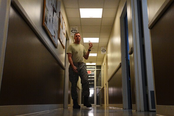 U.S. Air Force Master Sgt. Brig Ransom, 20th Civil Engineer Squadron program assurance and compliance superintendent, walks out of the men's restroom at the Drug Demand Reduction center at Shaw Air Force Base, S.C., March 25, 2014. Brigg was one of approximately 55 Airmen to receive a two-hour notice phone call and arrive at the facility for drug testing. (U.S. Air Force photo by Airman 1st Class Jensen Stidham/Released) 