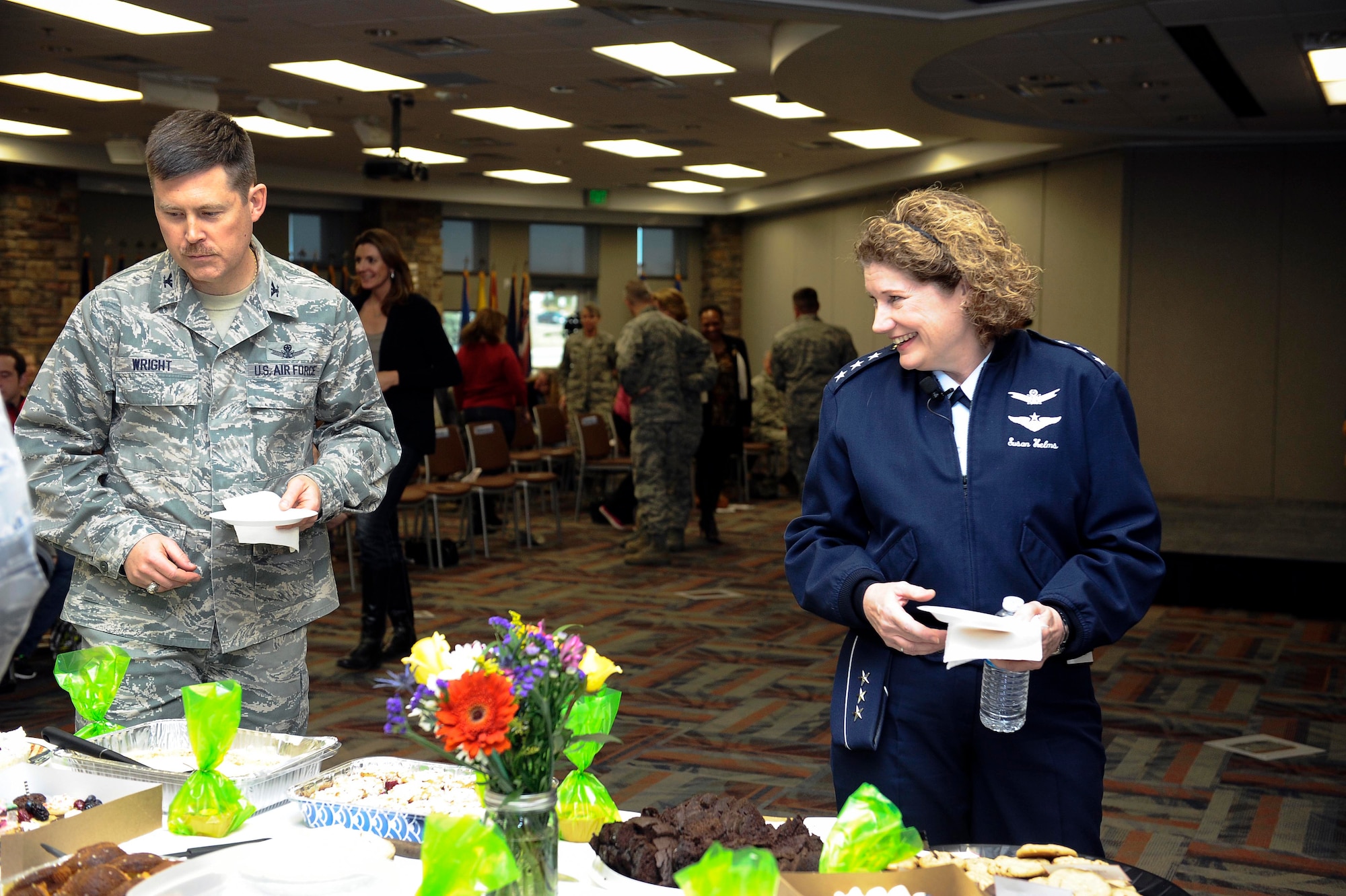 Lt. Gen. Susan Helms, former 14th Air Force, Air Force Space Command, Joint Functional Component Command for Space and U.S. Strategic Command commander, selects from a wide variety of treats during a dessert social March 21, 2014, at the Air Reserve Personnel Center conference room on Buckley Air Force Base, Colo. Helms visited Buckley in honor of Women’s History Month to speak on the importance of having a positive attitude and the power of women believing in themselves. (U.S. Air Force photo by Airman 1st Class Samantha Saulsbury/Released)