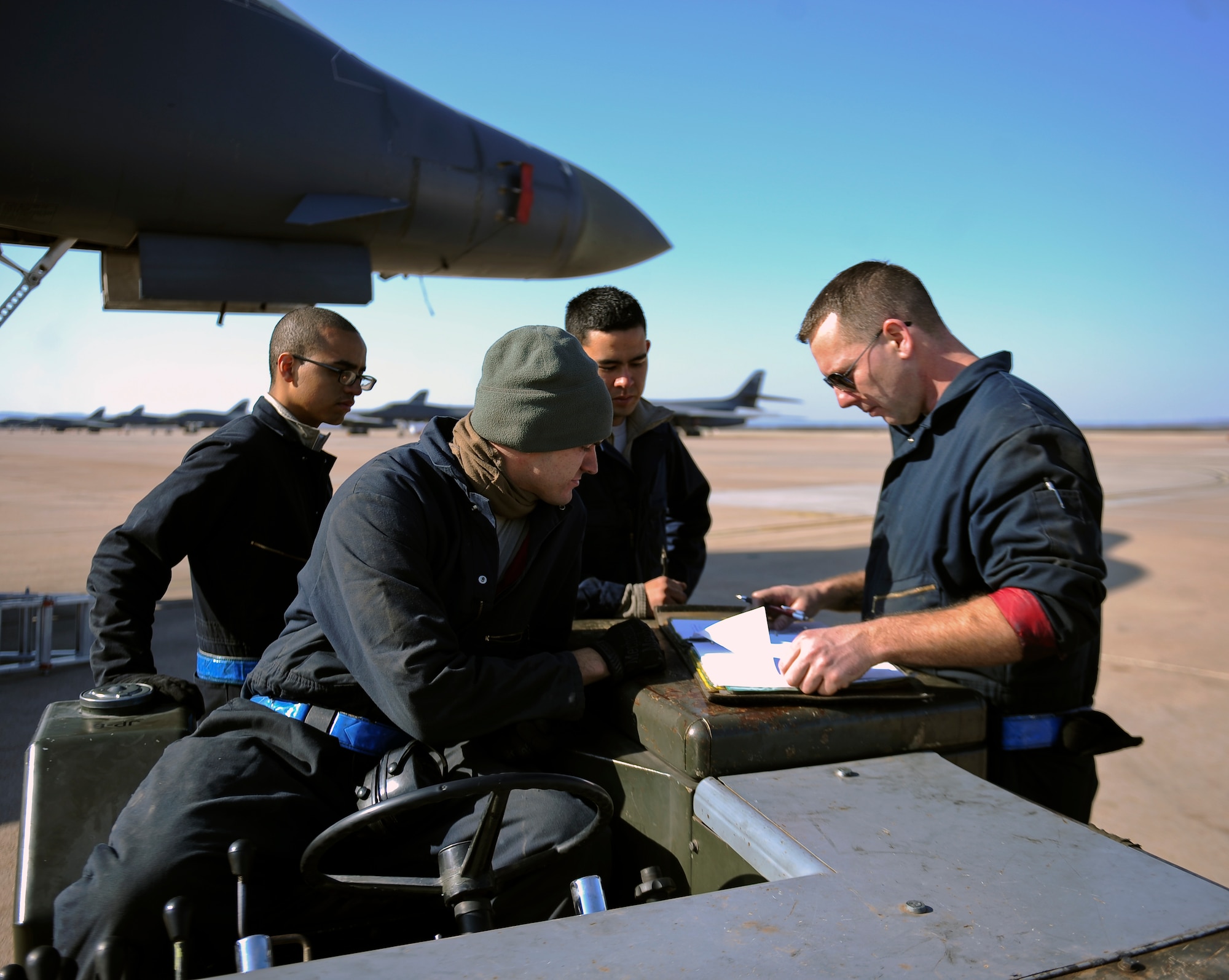 Airmen from the 7th Aircraft Maintenance Squadron review aircraft forms March 25, 2014, at Dyess Air Force Base, Texas. Checking these forms is the first step in any task, because it allows maintainers to view the current status of the aircraft they are working on and to annotate any issues they may come across. (U.S. Air Force photo by Airman 1st Class Kedesha Pennant/Released)