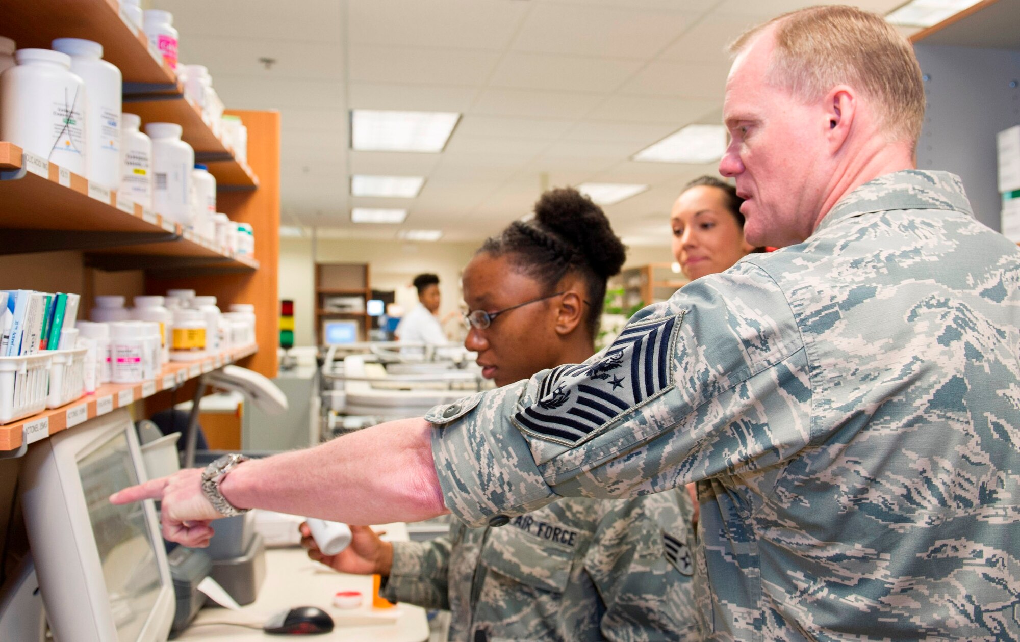 Chief Master Sgt. of the Air Force James Cody is briefed by Senior Airman Brittni Davis, 45th Medial Support Squadron, during a tour of the 45th Medical Group’s Satellite Pharmacy Tuesday, at Patrick Air Force Base, Fla. The Air Force’s highest ranking enlisted Airman arrived here Monday and spent three days with Team Patrick-Cape. (Air Force photo/Matthew Jurgens).