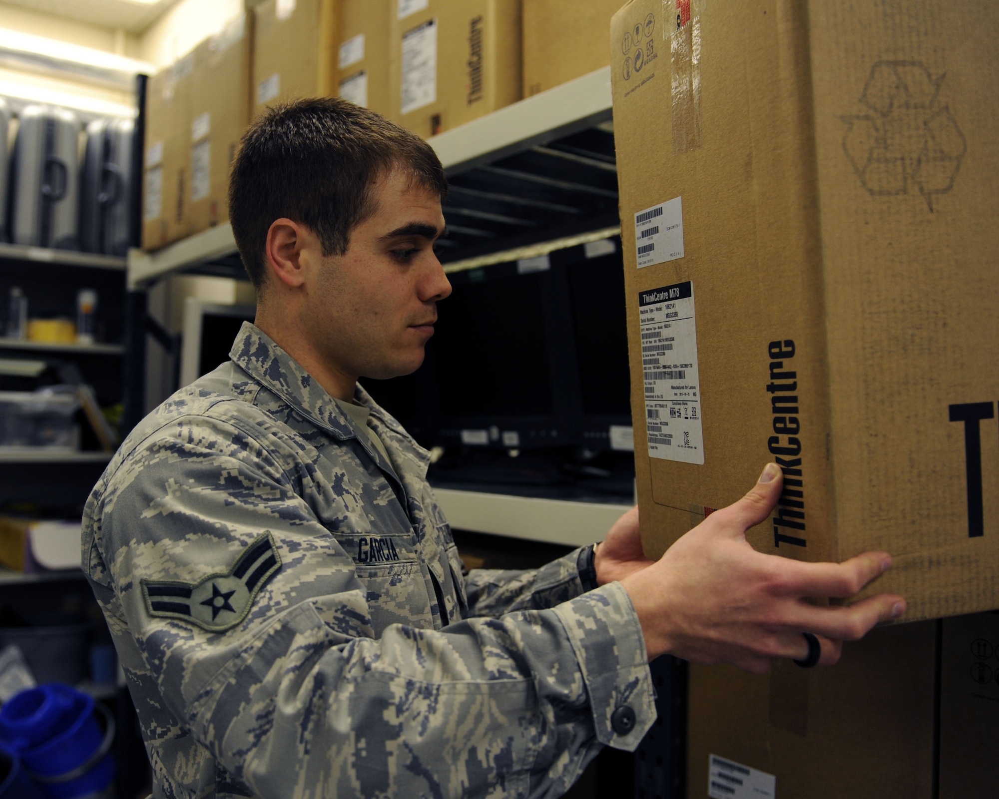 U.S. Air Force Airman 1st Class Christian Garcia, 100th Communication Squadron Information Technology Asset Management client systems technician from Los Angeles, checks the label of a desktop computer March 26, 2014, on RAF Mildenhall, England. The 100th CS ITAM office is responsible for the receipt and dispatch of all mission-enabling information technology assets on the installation. (U.S. Air Force photo by Airman 1st Class Preston Webb/Released)
