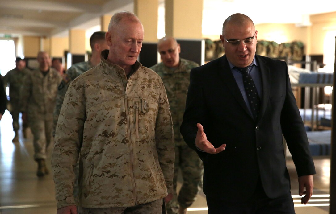 United States Marine Corps Lt. Gen. Richard Tryon, commander of U.S. Marine Corps Forces Command and U.S. Marine Corps Forces, Europe, tours the Georgian National Defense Academy facilities with Zurab Agladze, the rector of the NDA March 19, 2014. Tryon visited Georgia to attend the departure ceremony of Georgian Special Mountain Battalion and 23rd Bn., who are deploying to Afghanistan as part of the International Security Assistance Force, and he also toured the NDA during his visit. (Official Marine Corps photo by Lance Cpl. Scott W. Whiting, BSRF PAO/ Released)