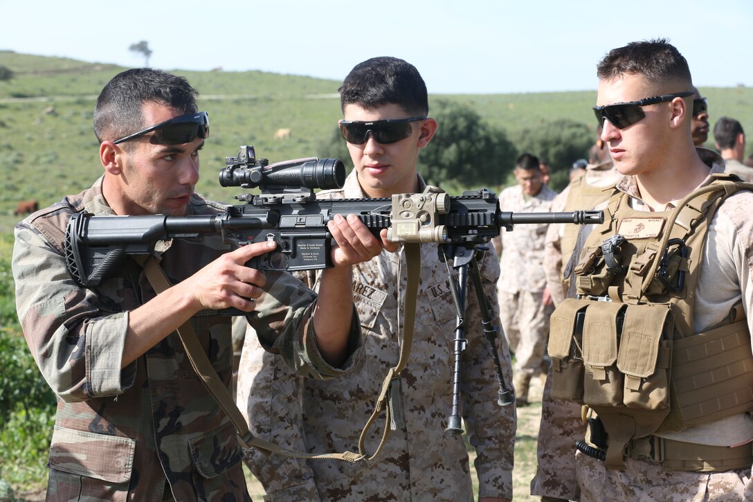 A Spanish Marine holds the M27 Infantry Automatic Rifle during a bilateral training exercise with U.S. Marines of Special-Purpose Marine Air-Ground Task Force Crisis Response in Sierra Del Retin, Spain, March 18, 2014. The training was conducted to further partnerships between SP-MAGTF CR and the European forces. (U.S. Marine Corps photo by Lance Cpl. Alexander Hill/Released)