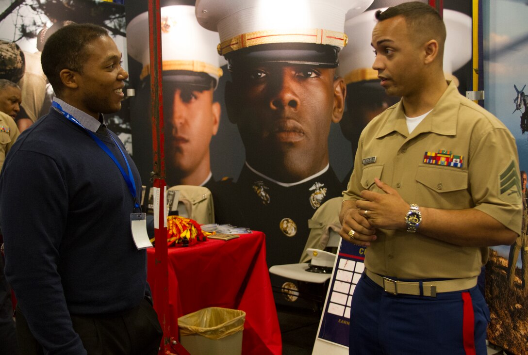 Sgt. Zonell Westfield, a recruiter from Recruiting Sub Station Murfreesboro, speaks to a college student at a career exploration event at the 40th annual National Society of Black Engineers Convention in Nashville, Tenn., March 27, 2014. The National Society of Black Engineers, founded in 1971, increased the number of culturally responsible black engineers who excel academically and positively impact the community. This is the fourth year the Marine Corps has partnered with NSBE. The United States Marine Corps also recognizes this event as a valuable opportunity to foster positive relationships with members, share the Marine story, demonstrate enthusiasm for the Corps and reinforce the idea of the armed services as a viable career option within the African American Community. There are currently 21,000 African American men and women serving in the United States Marine Corps, making up approximately 10% of the force. (Photo by Lance Cpl. Stanley Cao)