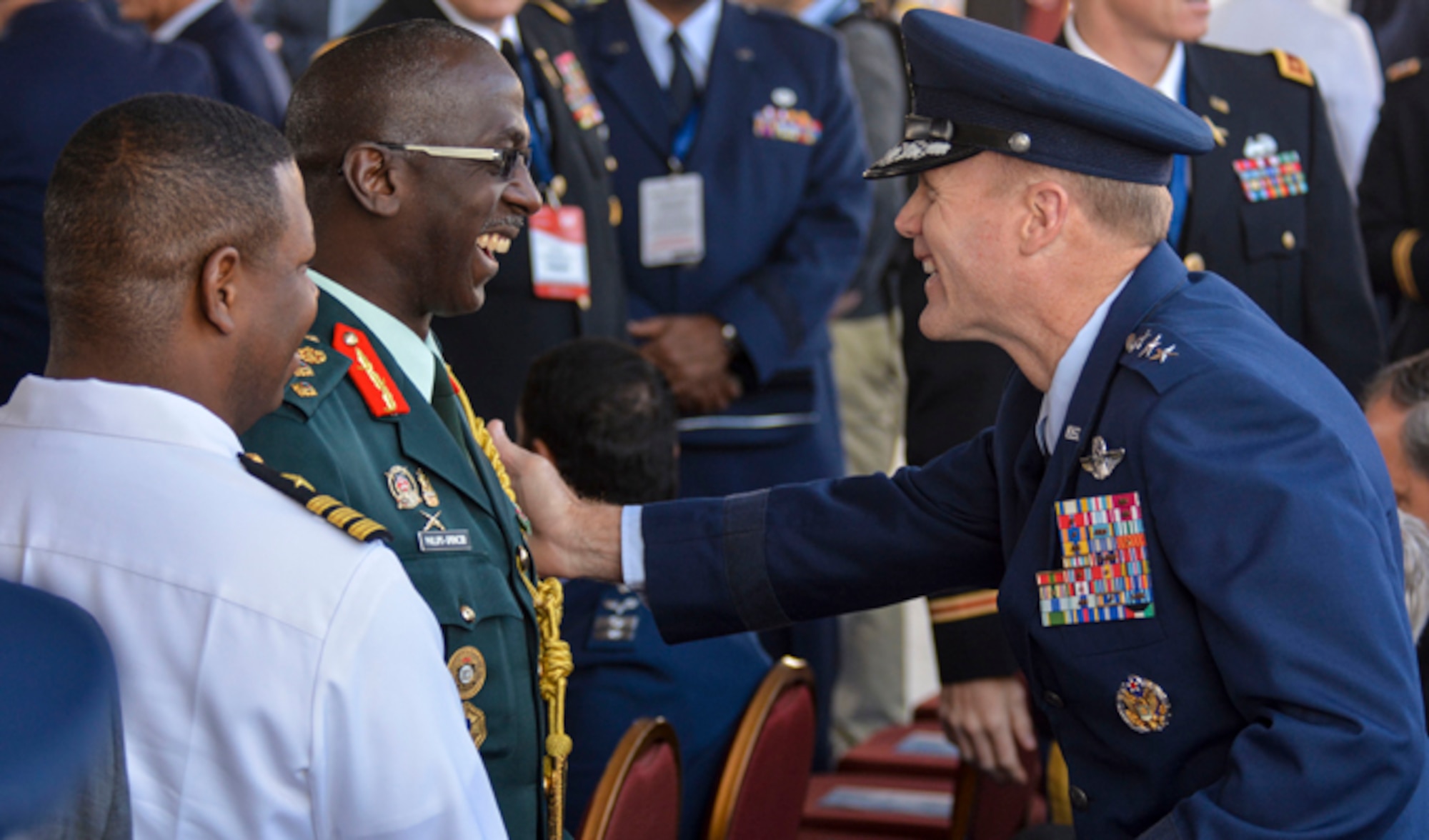 Lt. Gen. Tod Wolters, the 12th Air Force (Air Forces Southern) commander, greets Brig. Gen. Anthony Phillips-Spencer, vice chief of Defence Staff of the Trinidad and Tobago Defence Force, just before the FIDAE Air Show opening ceremony, March 25, 2014, in Santiago, Chile. Nearly 60 Airmen are participating in subject matter expert exchanges with Chilean air force counterparts during FIDAE. The exchanges involve U.S. Airmen sharing best practices and procedures to build partnerships and promote interoperability with partner-nations throughout South America, Central America and the Caribbean. (U.S. Air Force photo/Capt. Justin Brockhoff)