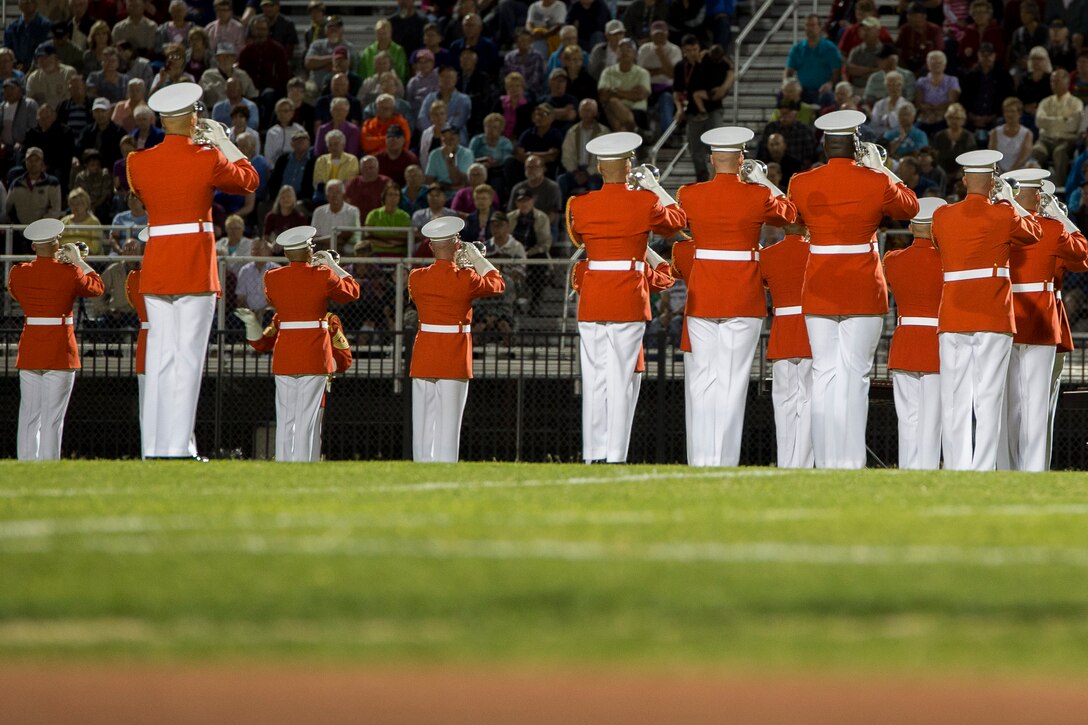 The U.S. Marine Drum & Bugle Corps perform in front of guests at Gila Ridge High School in Yuma, Az., March 7, 2014. The D&B performs across the country every year as part of the Marine Corps Battle Color Detachment. (Official Marine Corps photo by Cpl. Dan Hosack/Released)