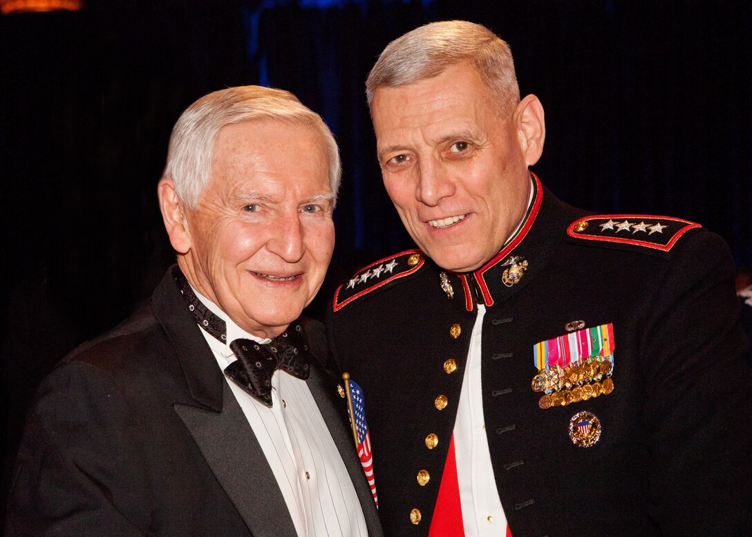 The Assistant Commandant of the Marine Corps, Gen. John M. Paxton, Jr., right, poses for a photo with M.L. "Buzz" Hefti during the Tragedy Assistance Program for Survivors (TAPS) Gala in Washington, D.C., March 27, 2014. This year was the 20th anniversary of TAPS. (U.S. Marine Corps photo by Cpl. Tia Dufour/Released)