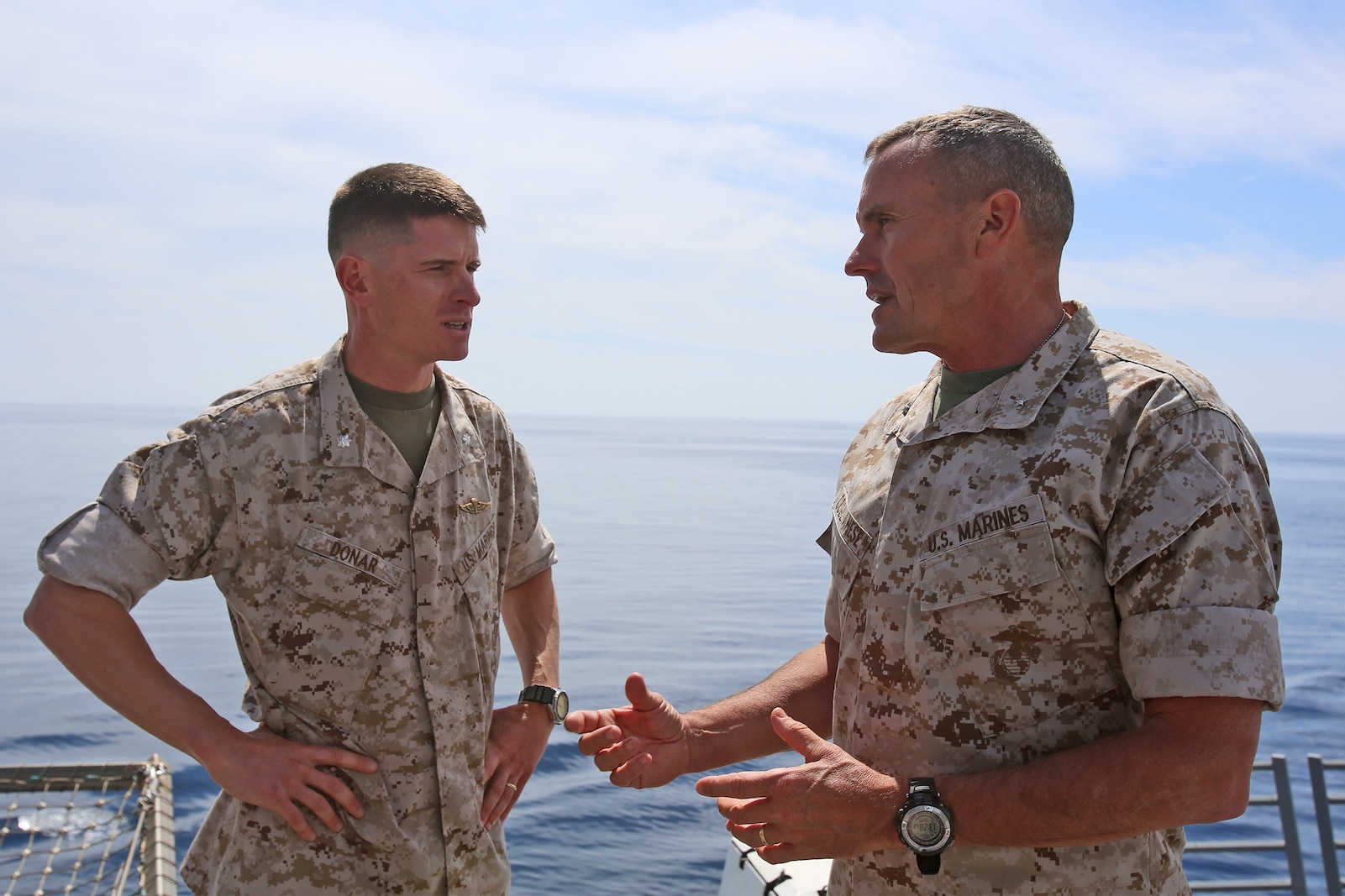 Lieutenant Col. Mark T. Donar, commanding officer, 1st Maintenance Battalion, 1st Marine Expeditionary Force, discusses his unit’s expeditionary capabilities with Brig. Gen. Vincent A. Coglianese, commanding general, 1st Marine Logistics Group, aboard the amphibious transport dock ship USS Anchorage (LPD 23), March 20, 2014. Anchorage, with embarked Marines from 1st MEF, was off the coast of California conducting amphibious warfare certification training. The Marines will conduct aircraft landing operations, live-fire training, martial arts and other drills to in order to maintain their position as an expeditionary force in readiness. 