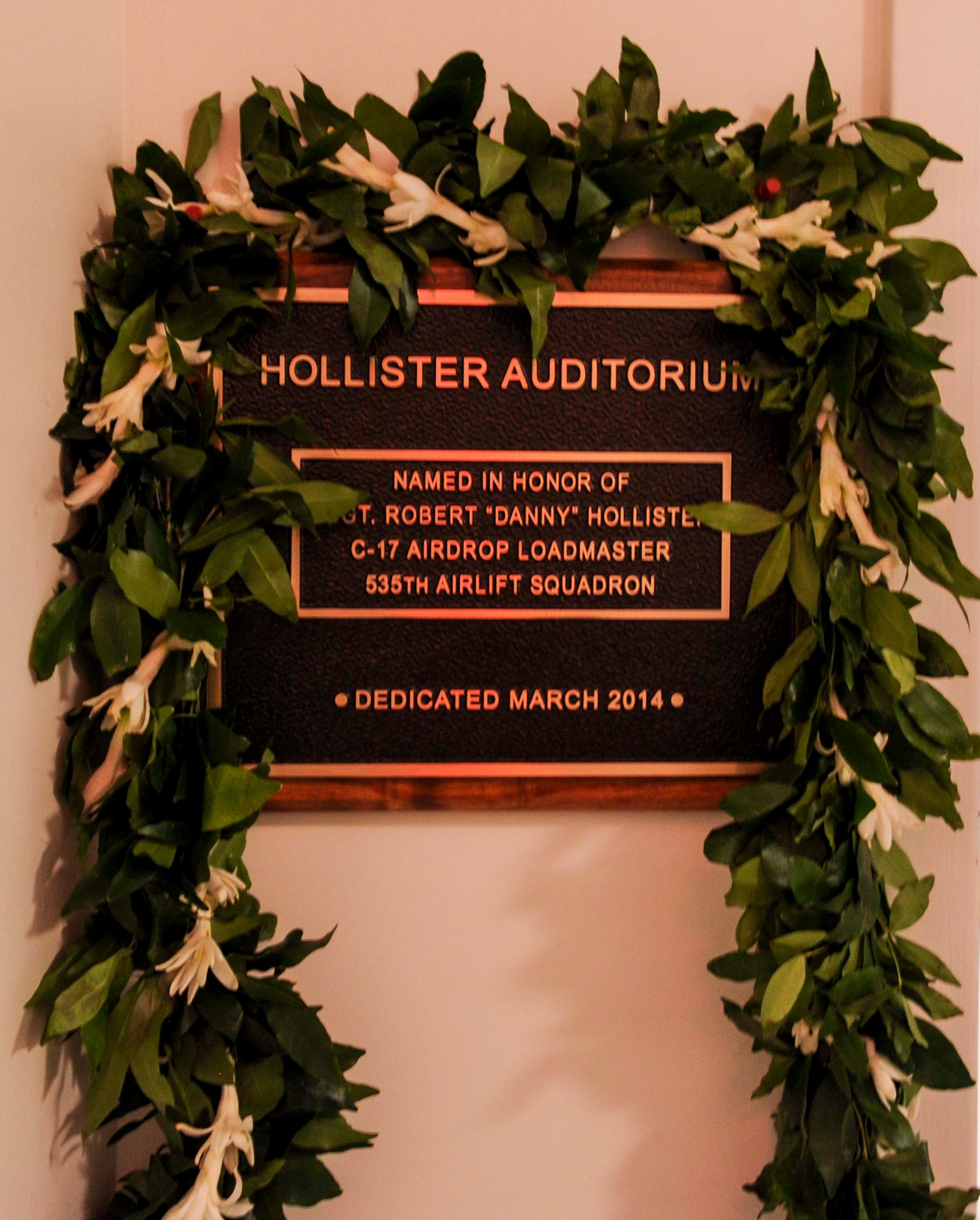 The 535th Airlift Squadron Auditorium was renamed the Hollister Auditorium in a rededication ceremony on Joint Base Pearl Harbor-Hickam, Hawaii, March 28, 2014. The auditorium is dedicated to fallen comrade, Staff Sgt. Robert “Danny” Hollister who was a 535th AS loadmaster here. (U.S. Air Force photo/Tech. Sgt. Terri Paden)