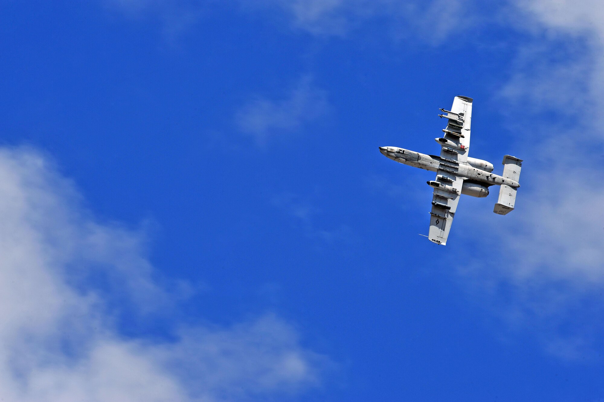 An A-10 Thunderbolt departs for a training mission at Davis-Monthan Air Force Base, Ariz., March 27, 2014.  The first production A-10A was delivered to Davis-Monthan Air Force Base, Ariz., in October 1975. (U.S. Air Force photo by Senior Airman Josh Slavin/Released)