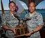 Maj. Gen. Kevin Pottinger, Mobilization Assistant to the Commander, Pacific Air Forces, ceremoniously transfers the Combined Federal Campaign eagle trophy to Maj. Gen. Darryll D.M. Wong, Hawaii adjutant general and director of civil defense, March 25, 2014, aboard the U.S.S. Missouri. The passing of the eagle trophy to the Hawaii National Guard designates them as the lead agency for the 2014 Combined Federal Campaign. (U.S. Air Force photo by Staff Sgt. Nathan Allen)