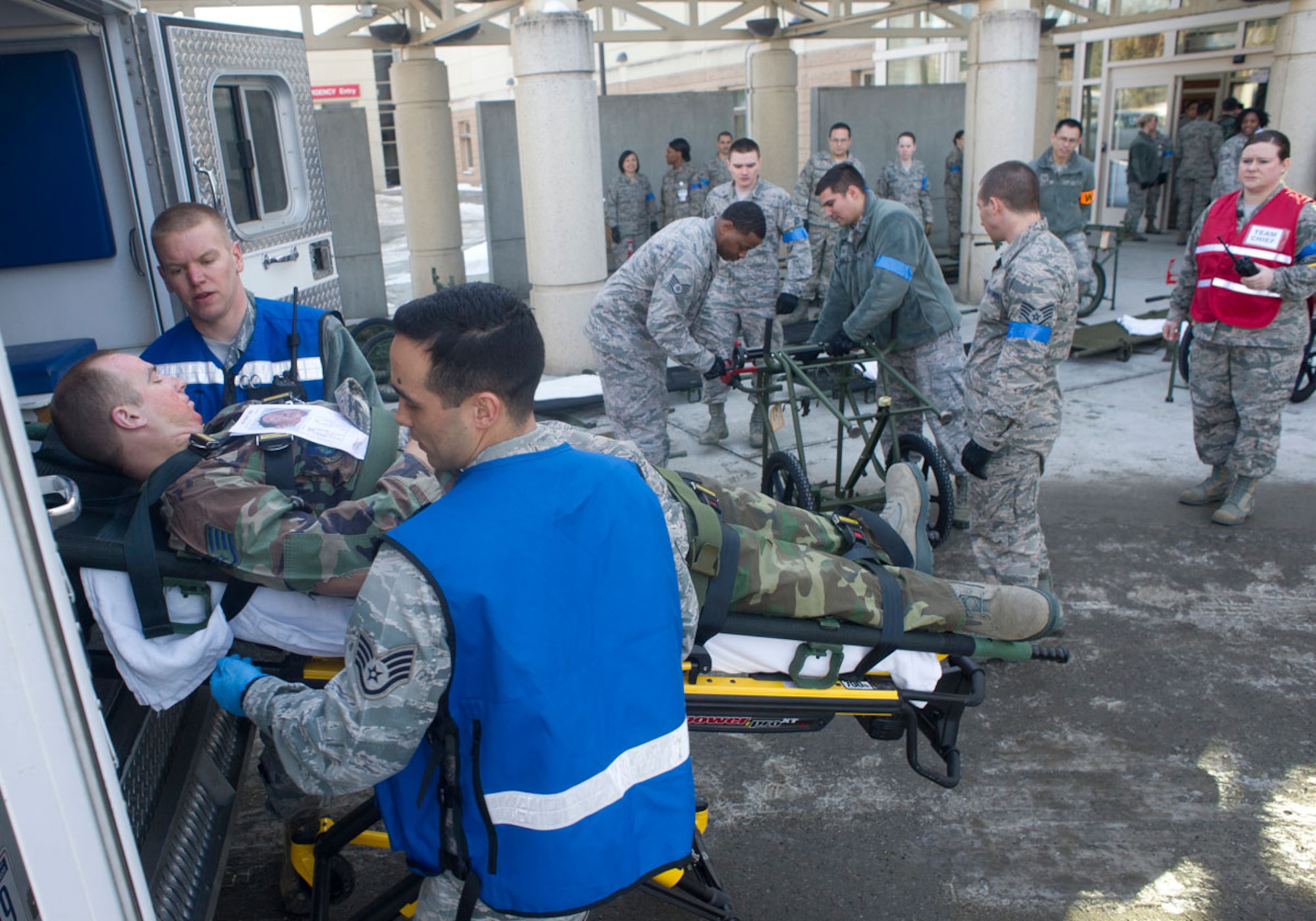 JOINT BASE ELMENDORF–RICHARDSON, Alaska--Airmen from 673d Medical Group transfer a simulated earthquake casualty from an ambulance to triage at Joint Base Elmendorf-Richardson, Alaska, March 27, 2014, during JBER's Mission Assurance Exercise 14-3. MAE 14-3 is a JBER exercise testing the base’s ability to survive, operate and coordinate during a major natural disaster. (U.S. Air Force photo/Justin Connaher)