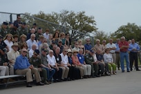 Joint Base San Antonio-Randolph community members gather at Washington Circle to honor former Vietnam War prisoners of war and those involved in their repatriation, and those still missing in action, during the 41st Freedom Flyer Reunion’s wreath laying ceremony March 28. (U.S. Air Force photo by Joel Martinez)