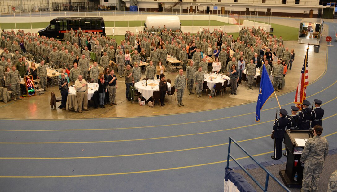 Ellsworth Honor Guard members present the colors during the 2013 Maintenance Professional of the Year banquet in the Pride Hangar at Ellsworth Air Force Base, S.D., March 21, 2014.The event was done to honor maintainers and recognize them for their hard work and dedication to the mission. (U.S. Air Force photo by Senior Airman Zachary Hada/Released)