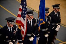 Ellsworth Honor Guard members stand ready to present the colors during the 2013 Maintenance Professional of the Year banquet in the Pride Hangar at Ellsworth Air Force Base, S.D., March 21, 2014. The MPOY banquet recognizes the achievements of the maintenance group and honors maintenance professionals each year. (U.S. Air Force photo by Senior Airman Zachary Hada/Released)