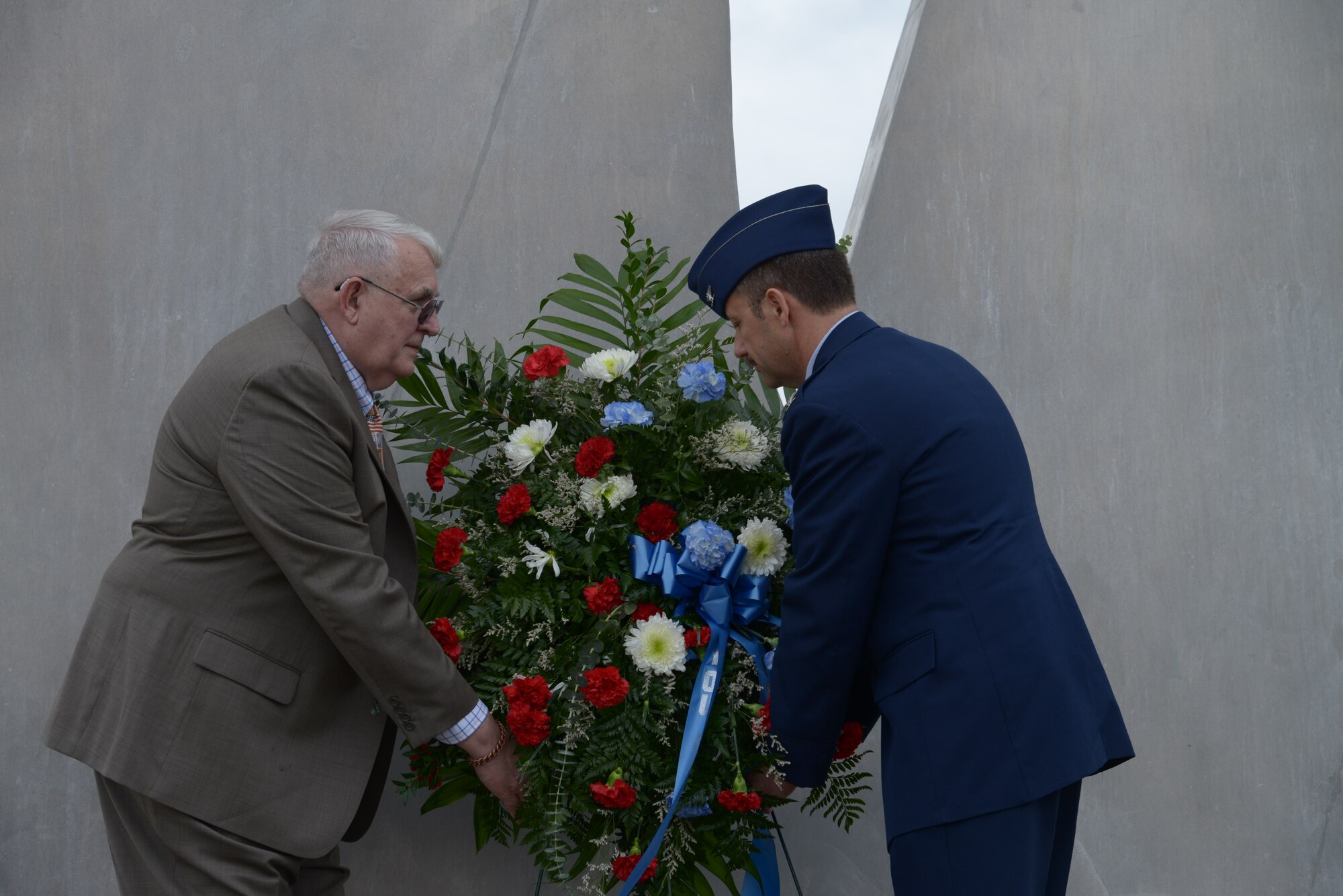 Retired Air Force Col. Wayne Erwin, Red River Valley Association; and Air Force Col. Gerald V. Goodfellow, 12th Flying Training Wing commander, place the wreath at the Joint Base San Antonio-Randolph Missing Man Monument during a wreath laying ceremony to honor prisoners of war and those missing in action March 28. For the past 41 years, the 560th Flying Training Squadron has hosted the Freedom Flyer Reunion for members of the 4th Allied POW Wing.  In addition to the wreath laying ceremony, each year a symposium that includes speakers representing POWs and spouses of POWs is also held at JBSA-Randolph. (U.S. Air Force photo by Joel Martinez)