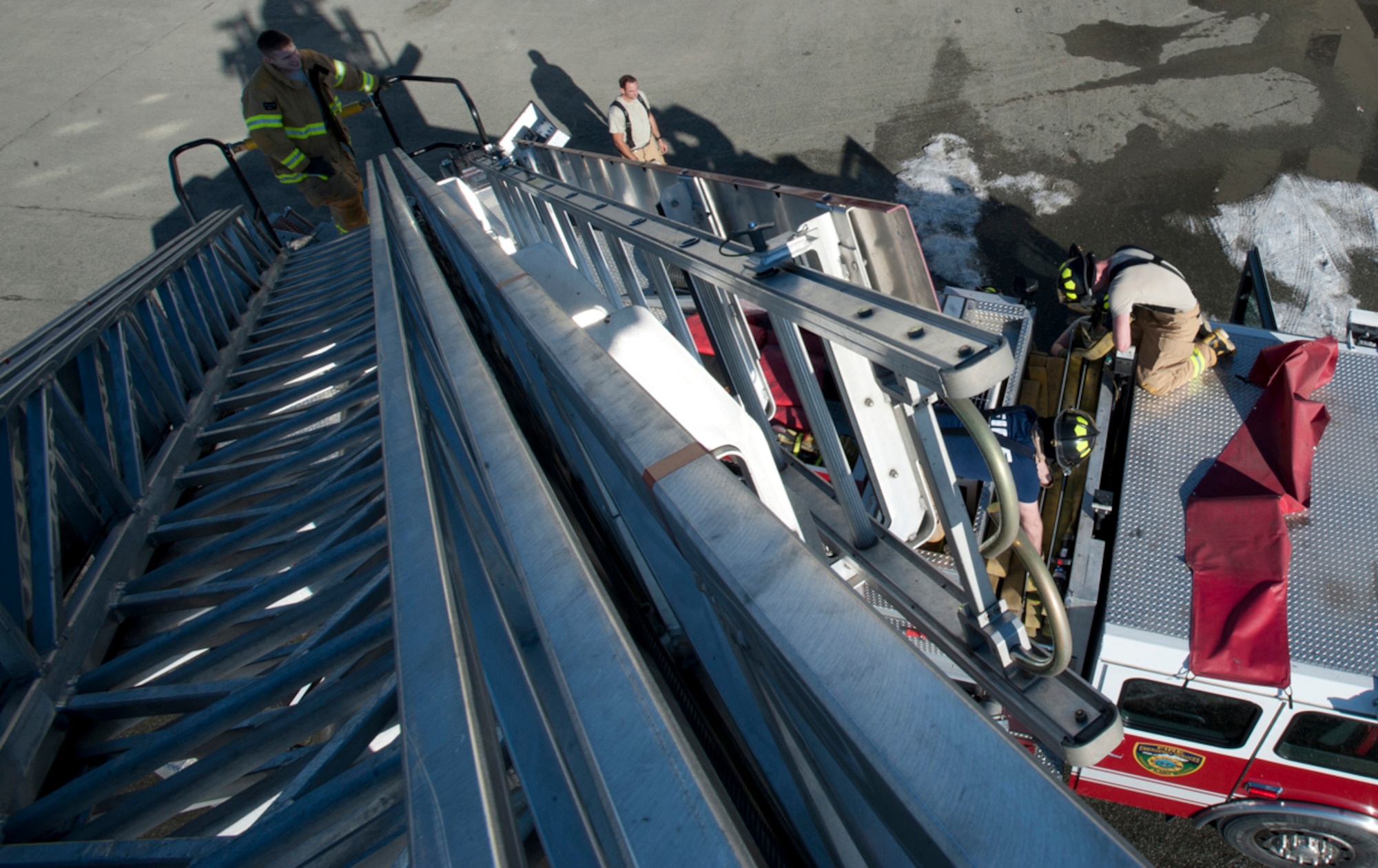 Firefighters from the 673d Civil Engineer Squadron pack up after a simulated earthquake emergency scenario during Joint Base Elmendorf-Richardson's Mission Assurance Exercise 14-3, part of the overall Alaska Shield disaster response preparedness and response exercise March 27, 2014. The JBER exercise is related to, and coordinated with, the Alaska Shield exercise, a full-scale exercise based on a catastrophic seismic event with outlying communities affected by the earthquake, tsunamis and supply chain disruption.  (U.S. Air Force photo/Staff Sgt. Robert Barnett)
