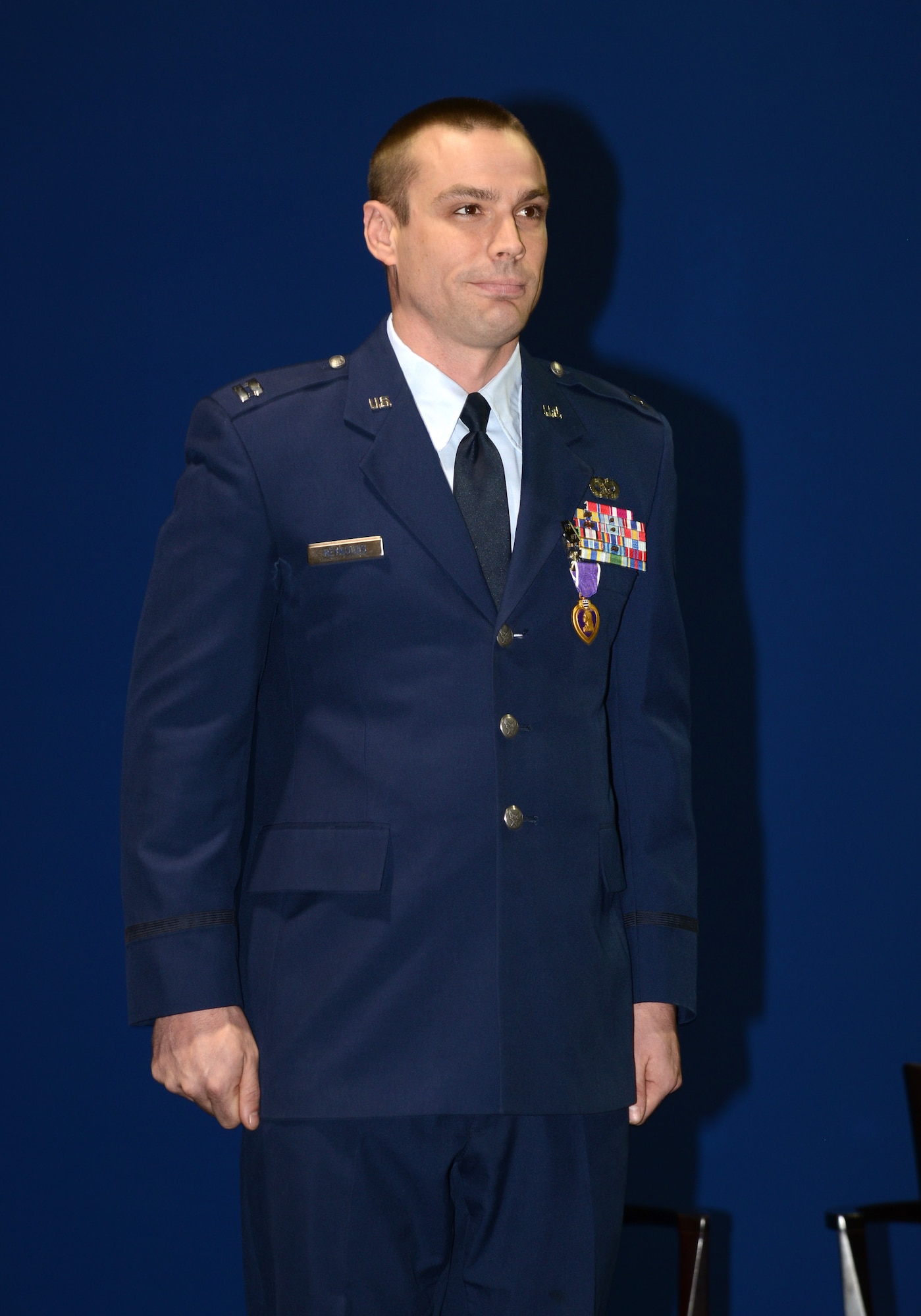 Capt. Alan Reynolds received the Purple Heart medal for injuries sustained in Afghanistan when his base came under attack by enemy forces in June 2012. (Air Force photo by Kelly White)