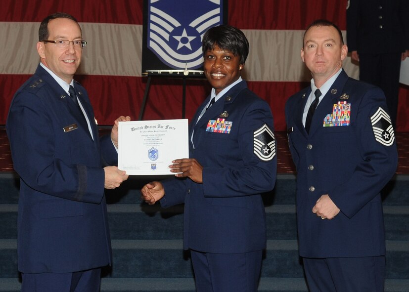 Senior Master Sgt. Kenyel Parker, Air Force Global Strike Command, receives a certificate of promotion from Maj. Gen. Robert Rego, AFGSC vice commander, during the January Wing Promotion Ceremony on Barksdale Air Force Base, La., Jan. 31, 2014. (U.S. Air Force photo)