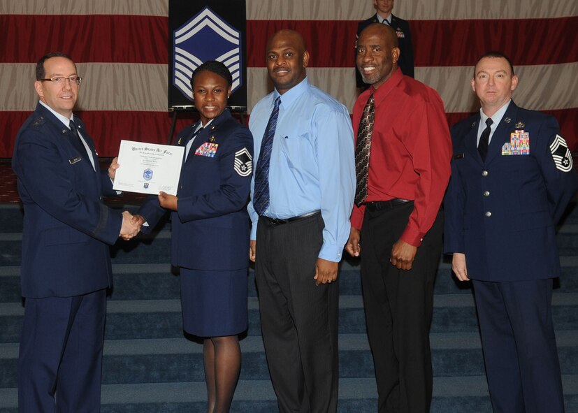 Senior Master Sgt. Katrina King, Air Force Global Strike Command, receives a certificate of promotion from Maj. Gen. Robert Rego, AFGSC vice commander, during the January Wing Promotion Ceremony on Barksdale Air Force Base, La., Jan. 31, 2014. (U.S. Air Force photo) 