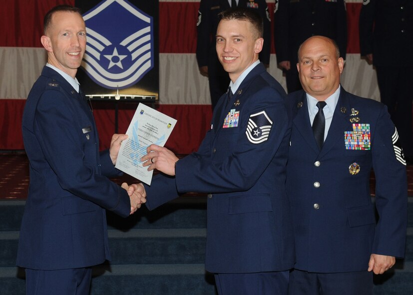 Master Sgt. Christopher Stephens, 2nd Communications Squadron, receives a certificate of promotion from Col. Leland Bohannon, 2nd Bomb Wing vice commander, and Chief Master Sgt. Stephen Lebrun, 2nd Operations Group, during the January Wing Promotion Ceremony on Barksdale Air Force Base, La., Jan. 31, 2014. (U.S. Air Force photo)