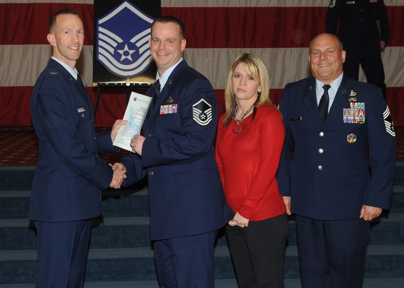Master Sgt. David Dudensing, 2nd Aircraft Maintenance Squadron, receives a certificate of promotion from Col. Leland Bohannon, 2nd Bomb Wing vice commander, and Chief Master Sgt. Stephen Lebrun, 2nd Operations Group, during the January Wing Promotion Ceremony on Barksdale Air Force Base, La., Jan. 31, 2014. (U.S. Air Force photo)
