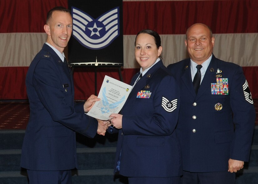 Tech. Sgt. Donna Dustin, 2nd Logistics Readiness Squadron, receives a certificate of promotion from Col. Leland Bohannon, 2nd Bomb Wing vice commander, and Chief Master Sgt. Stephen Lebrun, 2nd Operations Group, during the January Wing Promotion Ceremony on Barksdale Air Force Base, La., Jan. 31, 2014. (U.S. Air Force photo)