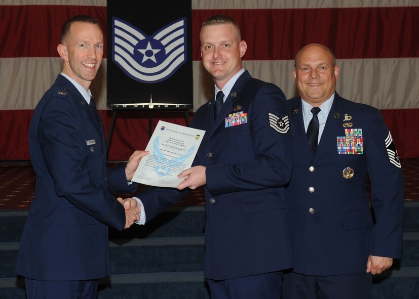 Tech. Sgt. Matthew Dorsett, 2nd Logistics Readiness Squadron, receives a certificate of promotion from Col. Leland Bohannon, 2nd Bomb Wing vice commander, and Chief Master Sgt. Stephen Lebrun, 2nd Operations Group, during the January Wing Promotion Ceremony on Barksdale Air Force Base, La., Jan. 31, 2014. (U.S. Air Force photo)