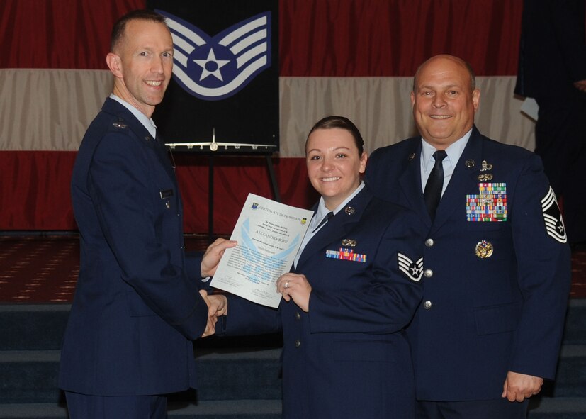Staff Sgt. Alexandra Boyd, 2nd Maintenance Squadron, receives a certificate of promotion from Col. Leland Bohannon, 2nd Bomb Wing vice commander, and Chief Master Sgt. Stephen Lebrun, 2nd Operations Group, during the January Wing Promotion Ceremony on Barksdale Air Force Base, La., Jan. 31, 2014. (U.S. Air Force photo)