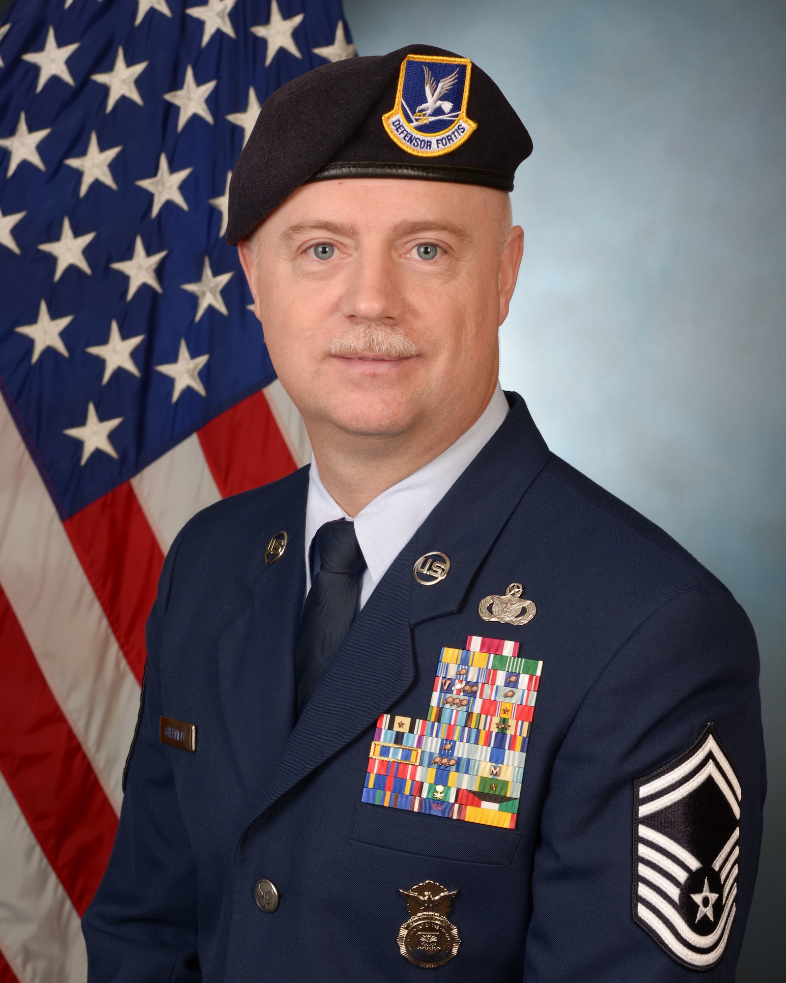 U.S. Air Force Senior Master Sgt. William Greenway, 116th Security Forces Squadron (SFS) superintendent, Georgia Air National Guard, poses for an official photo, Robins Air Force Base, Ga., Jan. 28, 2012. The 116th SFS is the security arm of the Joint STARS 116th Air Control Wing. (U.S. Air National Guard photo by Master Sgt. Roger Parsons/Released)