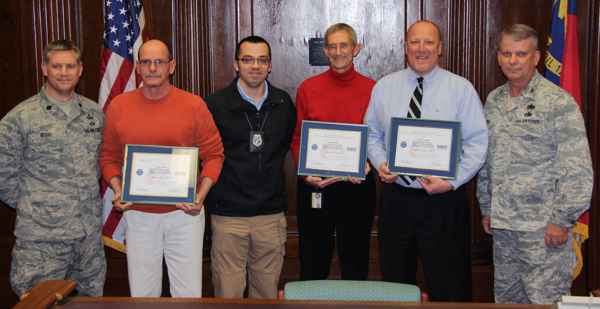 From left, Air Force Lt. Col. Jimmy Wood; Cumberland County Planning and Inspections Director Tom Lloyd; Code Enforcement Officer Christopher Fulton; Code Enforcement Manager Ken Sykes; Deputy Planning Director Cecil Combs; and Col. Don Wren. Lloyd, Sykes and Combs received Patriot Awards from the North Carolina Employer Support of Guard and Reserve Committee recognizing their support of Fulton, an Air Force reservist in the 440th Airlift Wing at Pope Army Airfield. Wren is the unit’s mission support group commander and Wood is the deputy commander. (Courtesy photo)