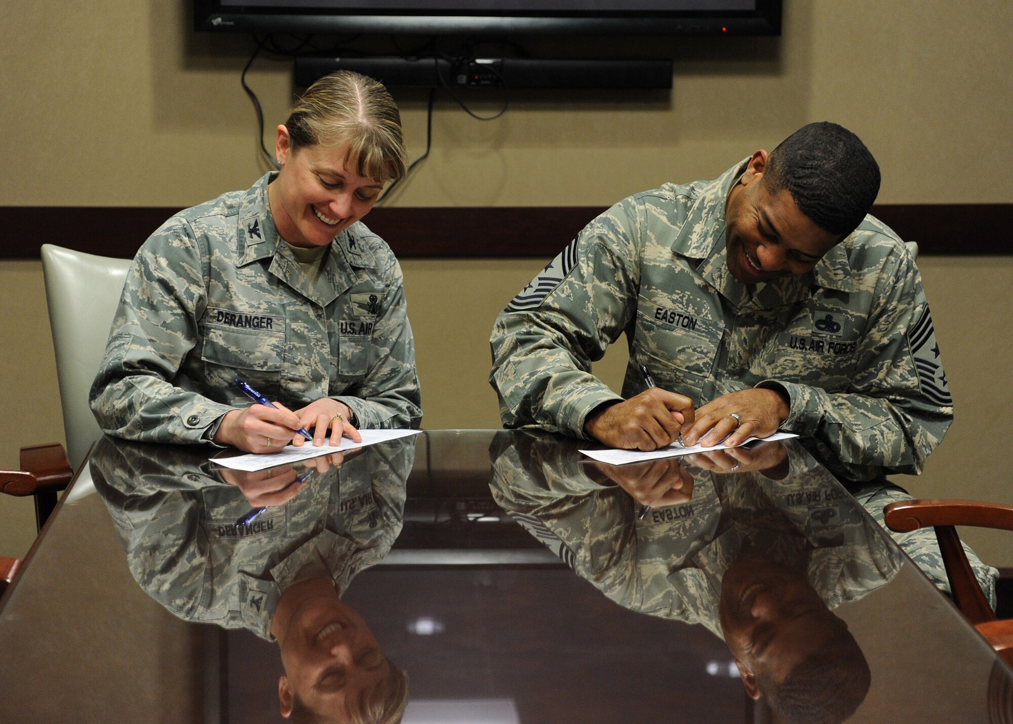 Col. Marné Deranger, 341st Missile Wing vice commander, and Chief Master Sgt. Phillip Easton, 341st MW command chief, fill out Air Force Assistance Fund campaign forms March 24. The AFAF allows Airmen the ability to donate to organizations put in place to aid members of the Air Force family in educational needs and financial hardships.  (U.S. Air Force photo/Senior Airman Cortney Paxton)
