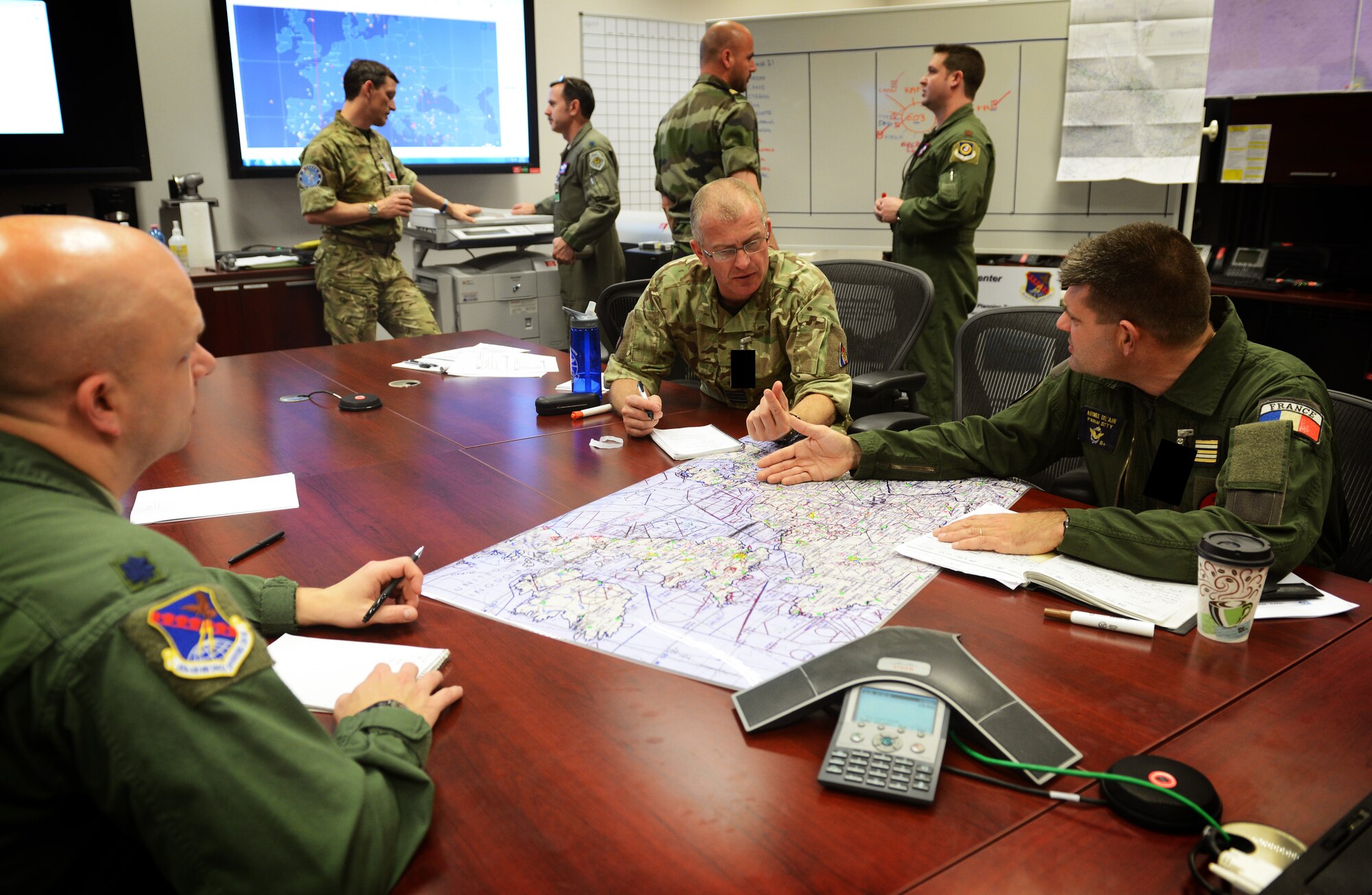 Sqn Ldr Gordon Ferguson from UK and LCL Pascal Sotty from France, plan the 
tri-lateral exercise, Tonnerre Lightning, with U.S. Air Force pilots and 603rd 
Air and Space Operations Center planning teams on March 27, 2014 at Ramstein Air Base, Germany. The exercise is the first in a series of semi-annual exercises between the NATO countries to improve interoperability and communication in the event of a real-world scenario. This first exercise was conducted off of the English coast and focused on strengthening communication between all agencies involved. (U.S. Air Force photo/Staff Sgt. Ryan Crane/Released)
