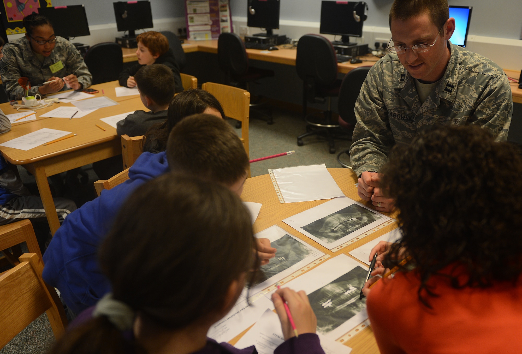 Captain Douglas Grabowski, 48th Dental Squadron advanced clinical dentist, teaches a teeth and scientific inquiry station during the 8th bi-annual Science, Technology, Engineering, and Mathematics Day at Lakenheath Intermediate School at Royal Air Force Lakenheath, England, March 25, 2014. During STEM day, students rotated through a variety of hands-on activities including a digital star lab, puff mobiles, bridge construction, astronomy maps, and teeth and scientific inquiries led by subject matter experts. “Our school participates in different activities throughout the year to immerse 4th and 5th graders into STEM,” said Randi Dalton, STEM coordinator. “Those activities include STEM workshops, contests, clubs, and military and British guest speakers.” (U.S. Air Force photo by Airman 1st Class Trevor T. McBride/Released)