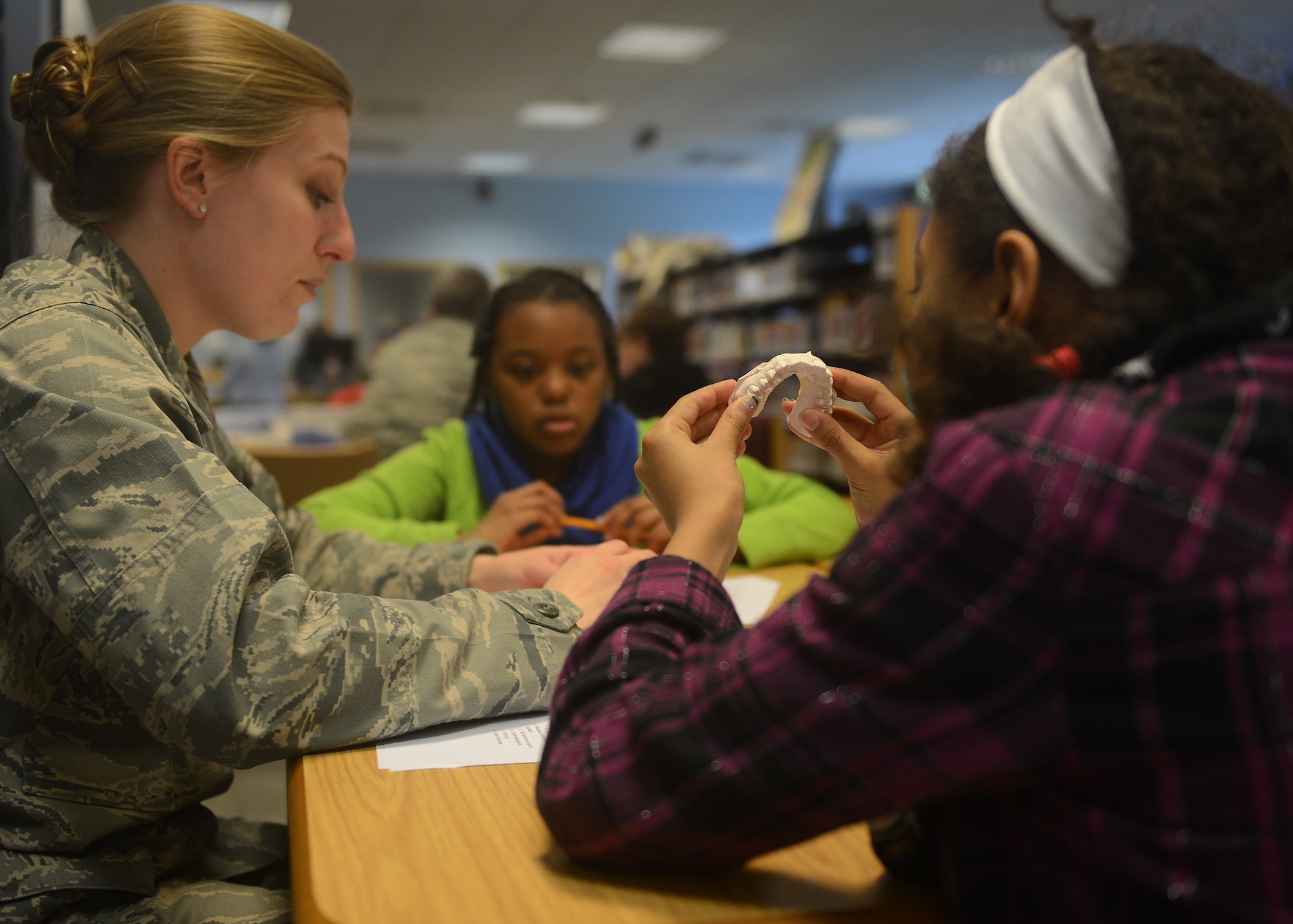 Lakenheath Intermediate School students receive instruction on the 8th bi-annual Science, Technology, Engineering, and Mathematics Day at Royal Air Force Lakenheath, England, March 25, 2014. During STEM day, students rotated through a variety of hands-on activities, including a digital star lab, puff mobiles, bridge construction, astronomy maps, and teeth and scientific inquiries led by subject matter experts. “Our school participates in different activities throughout the year to immerse 4th and 5th graders into STEM,” said Randi Dalton, STEM coordinator. “Those activities include STEM workshops, contests, clubs, and military and British guest speakers.” (U.S. Air Force photo by Airman 1st Class Trevor T. McBride/Released)