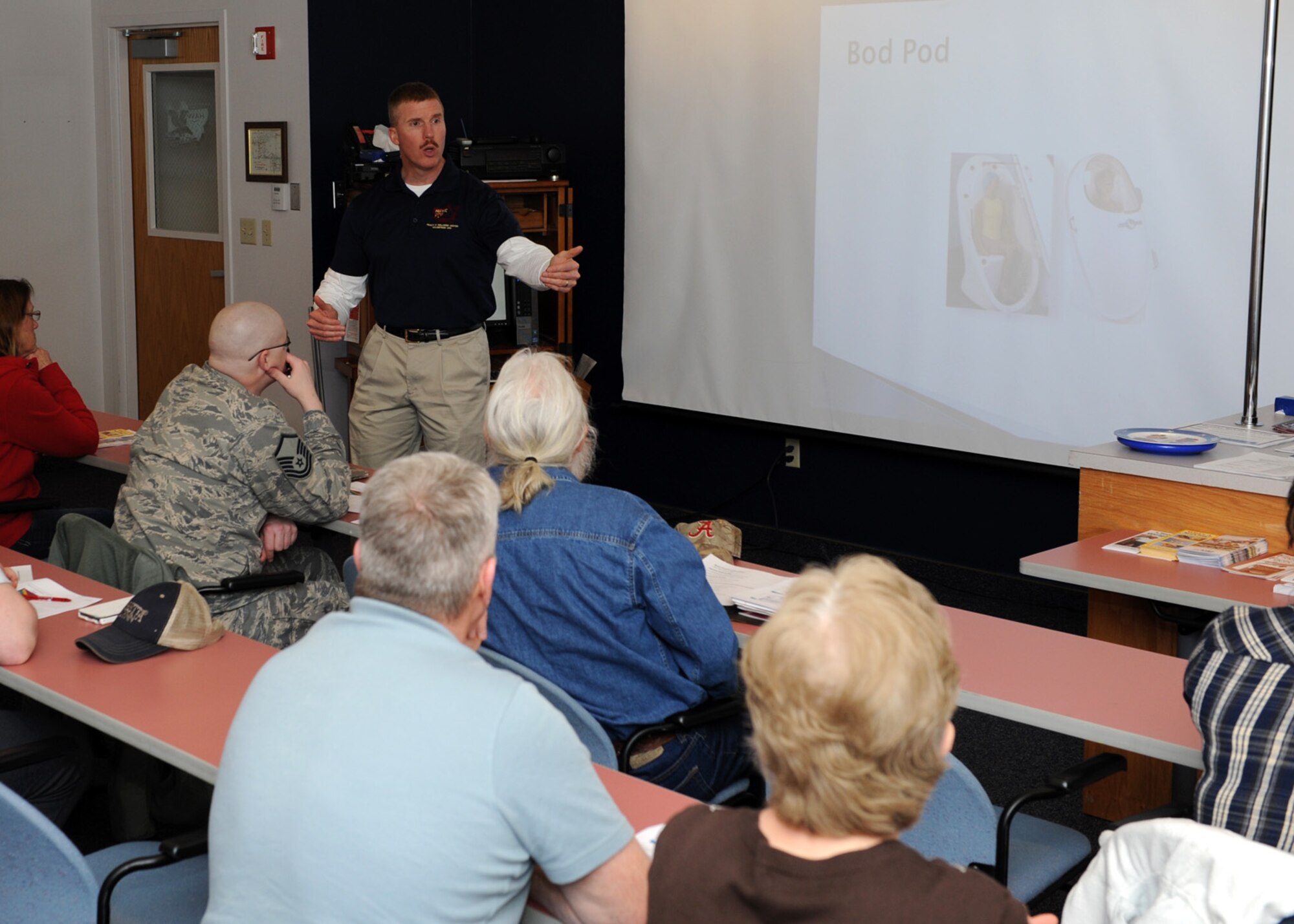 Kirk Clark, 341st Medical Operations Squadron Health and Wellness Center exercise physiologist, discusses how a body composition by air displacement instrument, or bod pod, works to measure fat percentage during a Weapons of Mass Reduction class at the Malmstrom HAWC on March 24. The HAWC provides year-round classes to assist Team Malmstrom personnel with their nutritional and physical training needs. (U.S. Air Force photo/Senior Airman Katrina Heikkinen)