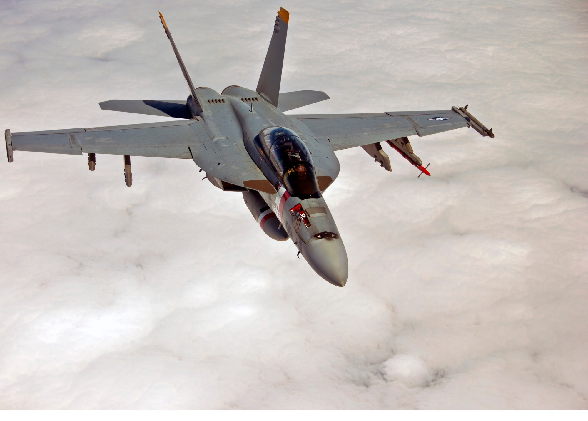 After an aerial refueling, a Naval F-18 Super Hornet from the USS Reagan escorts a Travis KC-10 Extender March 24 in the joint-service advanced combat operations training. Moments later, the F-18 will have to ward off other fighters acting as adversaries for the training. (U.S. Air Force photo/Senior Airman Madelyn Brown)
