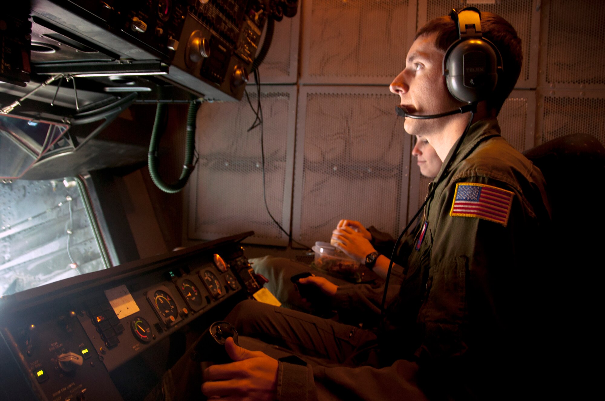 Staff Sgt. Jeff Suddy, 9th Air Refueling Squadron KC-10 boom operator, prepares to refuel a C-17 Globemaster III March 24 while flying down the California coast in support of the advanced combat operations training. (U.S. Air Force photo/Senior Airman Madelyn Brown)