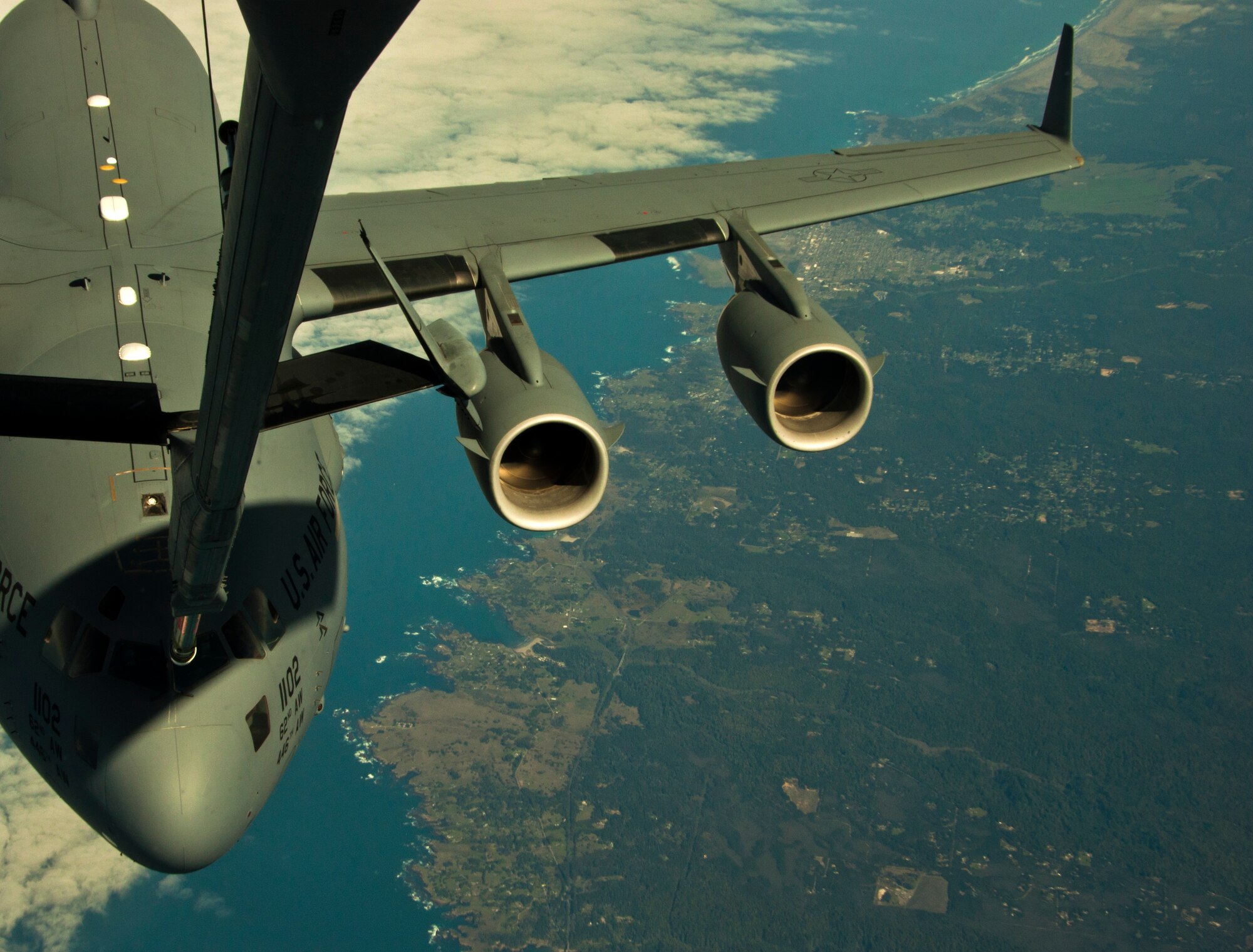 A 62nd Airlift Wing C-17 Globemaster III receives an aerial refuel from a 60th Air Mobility Wing KC-10 Extender Monday over the California coast en route to San Diego. The advanced combat operations training involved aircraft from Joint Base Lewis-McChord, Fairchild Air Force Base, Travis Air Force Base and Navy Carrier Wing 2. (U.S. Air Force photo/Senior Airman Madelyn Brown)