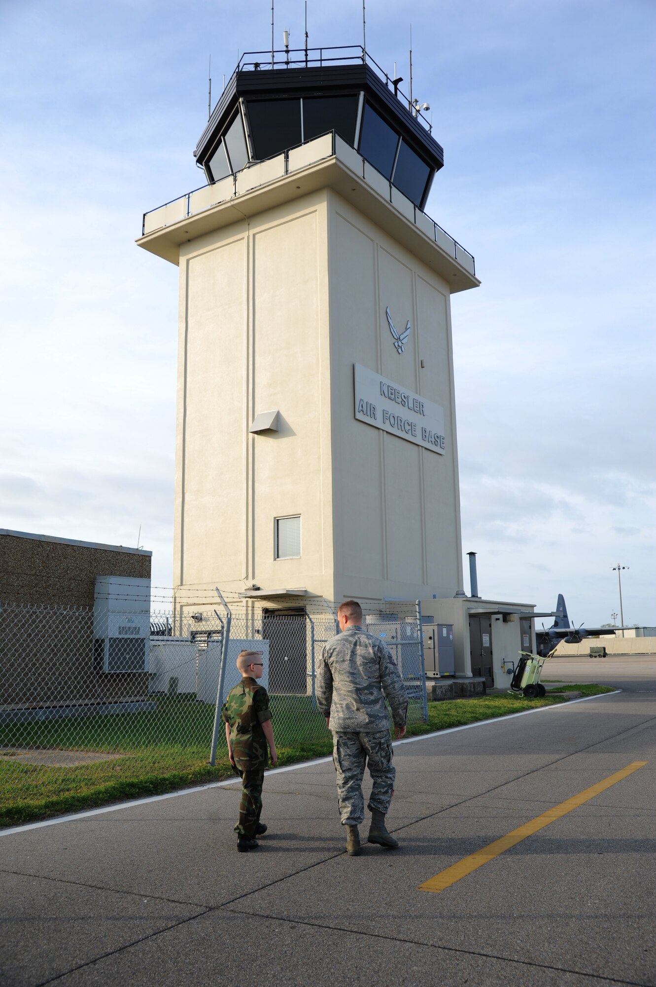 Eleven-year-old Cody Jackson is escorted by Tech. Sgt. David Hough, 81st Operation Support Flight, to tour the air traffic control tower March 27, 2014, Keesler Air Force Base, Miss.  Jackson, from Alpharetta, Ga., is known as "One Boy USO" for his personal mission to thank as many military members as he can, either by shaking hands, welcoming them home or sending packages to deployed troops.  He was accompanied by his parents and staff members from the local chapter of the American Red Cross. (U.S. Air Force photo by Kemberly Groue)