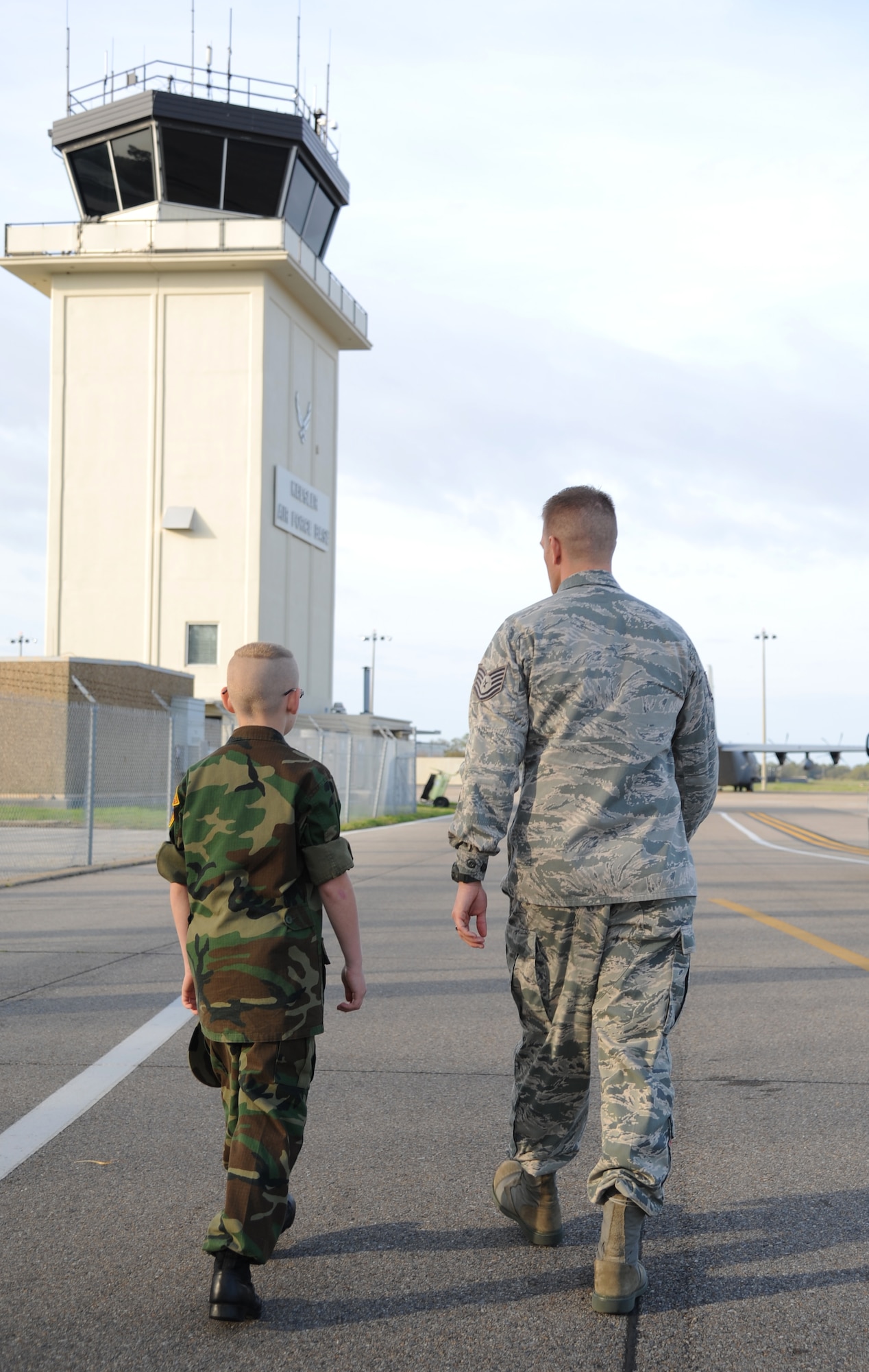 Eleven-year-old Cody Jackson is escorted by Tech. Sgt. David Hough, 81st Operation Support Flight, to tour the air traffic control tower March 27, 2014, Keesler Air Force Base, Miss.  Jackson, from Alpharetta, Ga., is known as "One Boy USO" for his personal mission to thank as many military members as he can, either by shaking hands, welcoming them home or sending packages to deployed troops.  He was accompanied by his parents and staff members from the local chapter of the American Red Cross. (U.S. Air Force photo by Kemberly Groue)