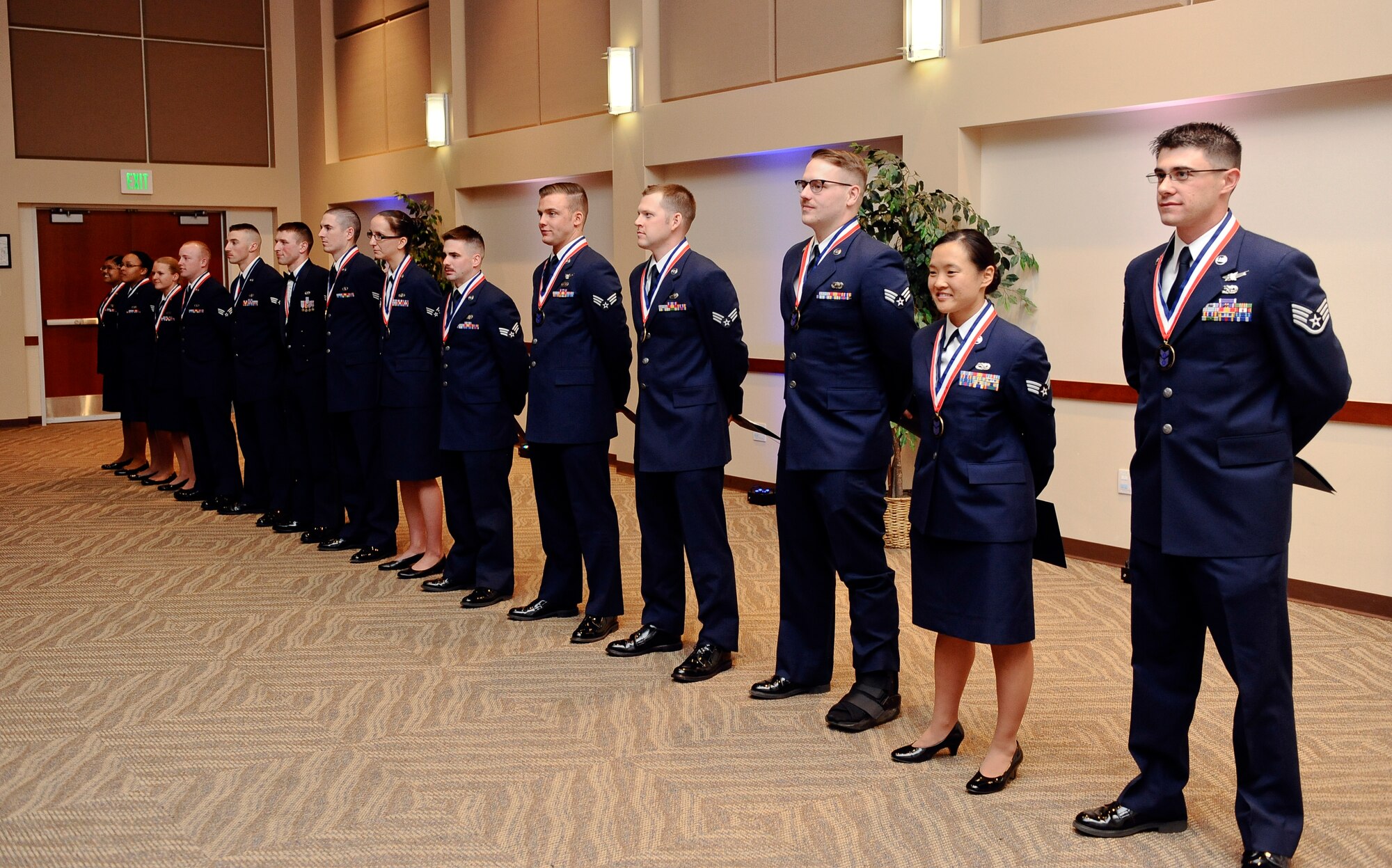 Buckley Airman Leadership School Class 14-C stands in a line after their graduation March 27, 2014, at the Leadership Development Center on Buckley Air Force Base, Colo. This graduation represents an important part of the enlisted force professional military education, teaching valuable skills required for supervisors. (U.S. Air Force photo by Airman 1st Class Samantha Saulsbury/Released)