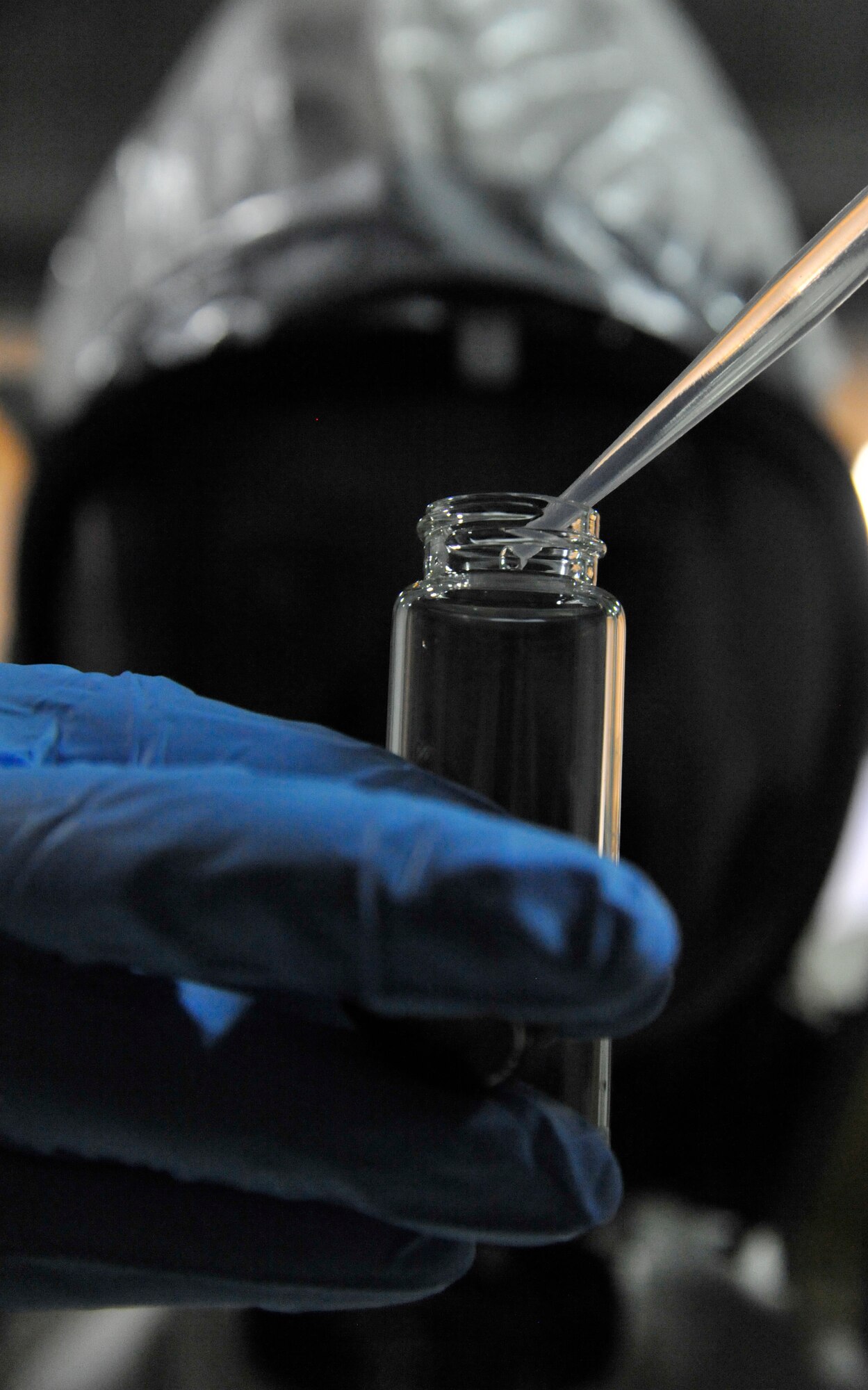 U.S. Air Force Tech. Sgt. Annemieke LeBorgne, 509th Medical Operations Squadron NCO in charge of Occupational Health, samples a liquid at Whiteman Air Force Base, Mo., March 12, 2014. All foreign liquids are brought to the lab for testing and evaluation purposes.   (U.S. Air Force photo by Airman 1st Class Keenan Berry/Released)