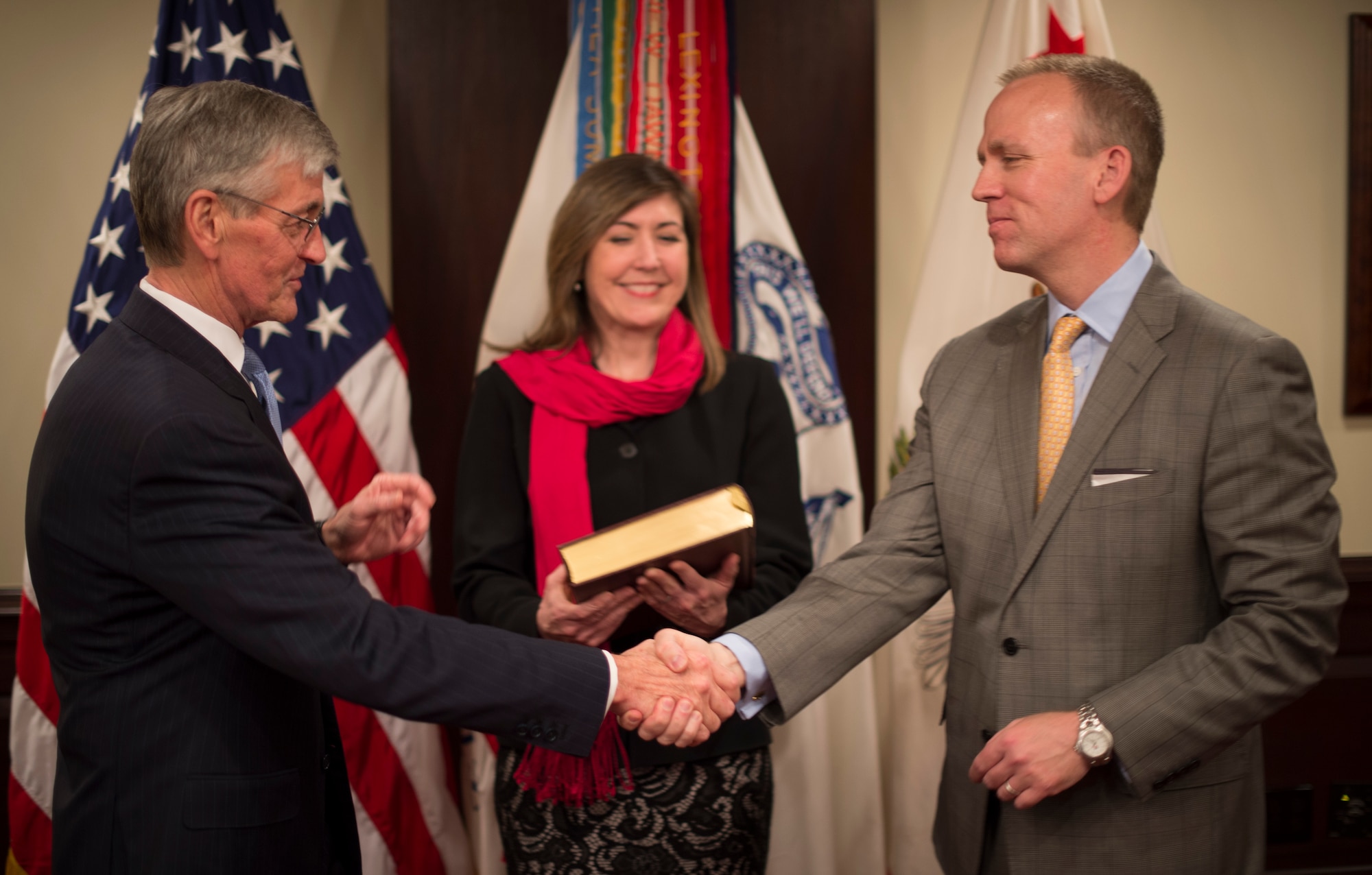 Secretary of the Army John McHugh congratulates Brad R. Carson, and his wife, Julie, after he administered the oath of office for Carson to be the 31st Under Secretary of the Army during a ceremony at the Pentagon, March 27, 2014. Carson previously served as the Army's 20th General Counsel, a position held since 2012. (U.S. Army photo by Staff Sgt. Bernardo E. Fuller/Released)